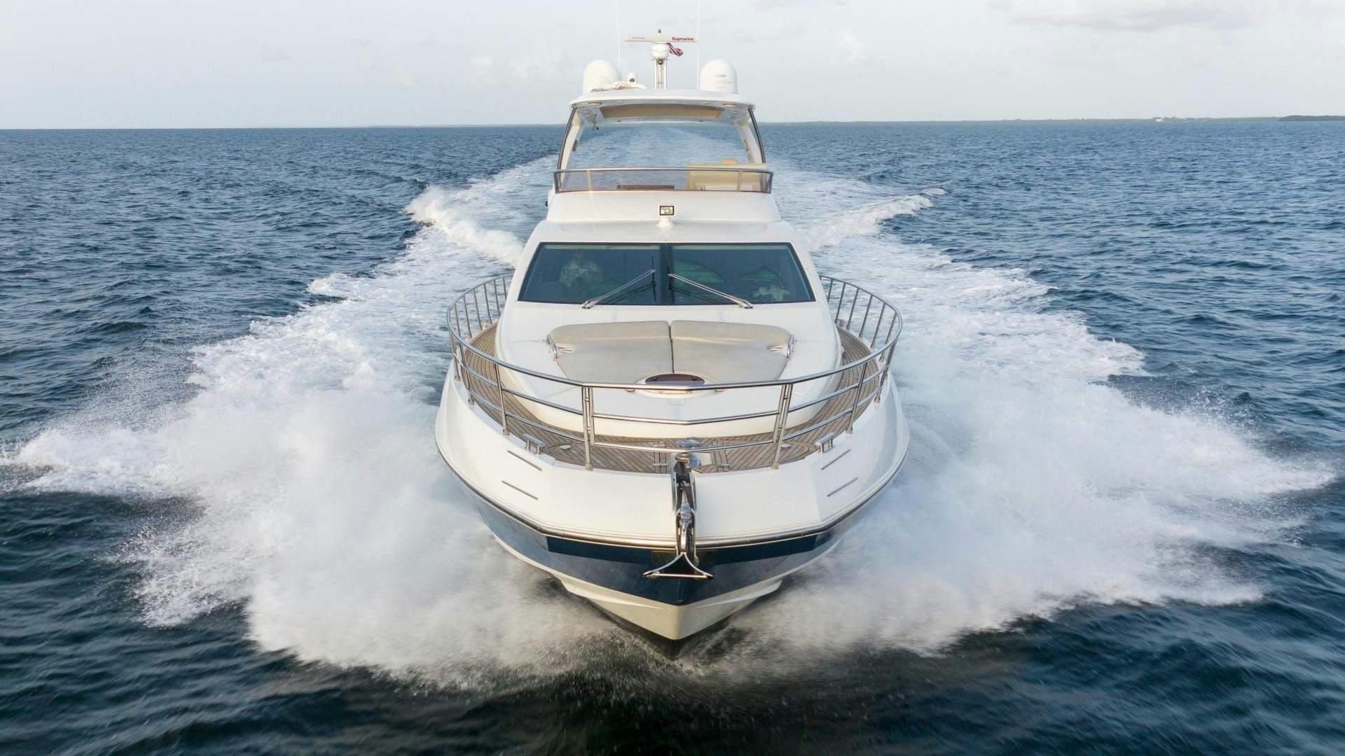 a white boat on the water aboard 4-PLAY Yacht for Sale