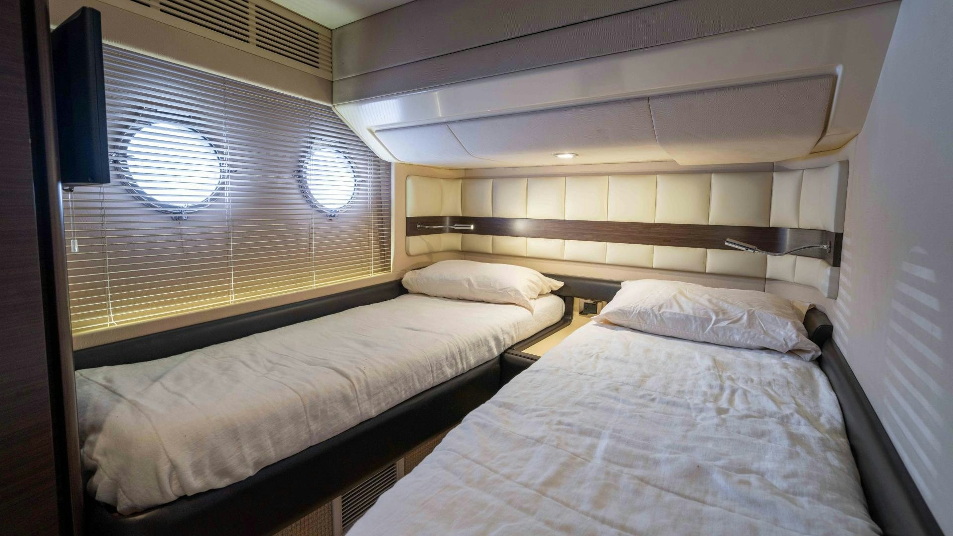 a room with two beds aboard 4-PLAY Yacht for Sale