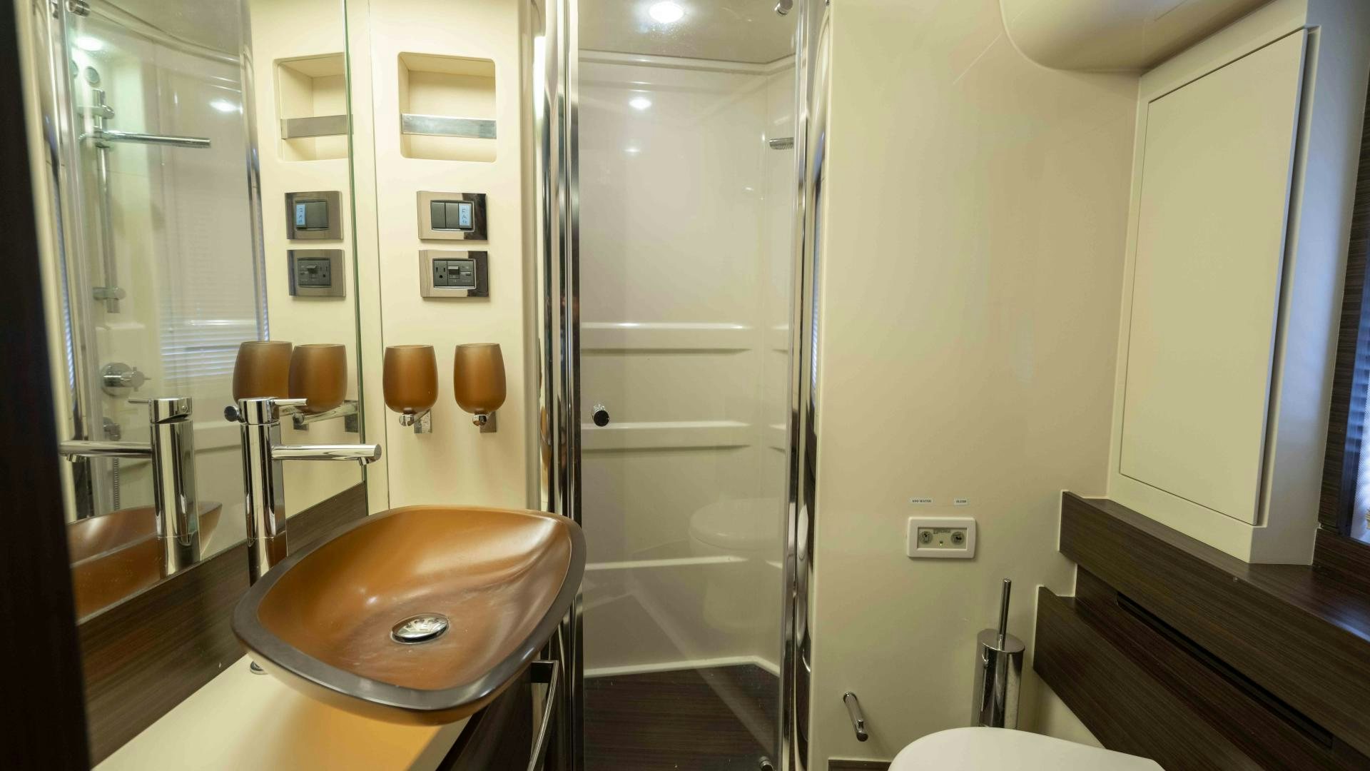 a room with a table and chairs aboard 4-PLAY Yacht for Sale