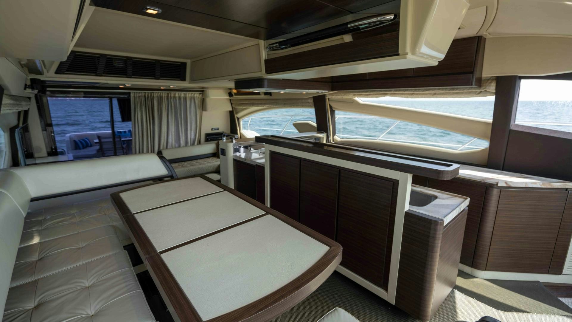 a room with a table and chairs aboard 4-PLAY Yacht for Sale
