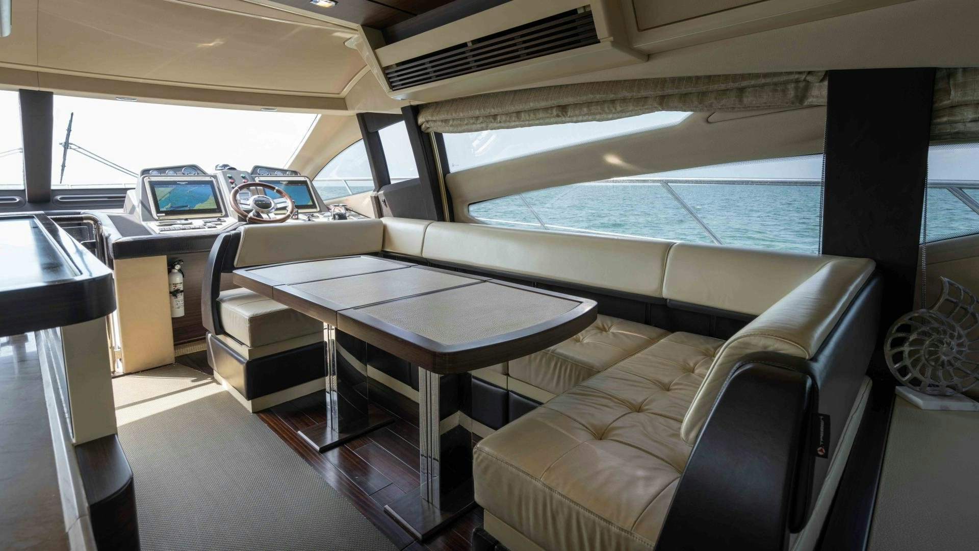 a room with a table and chairs aboard 4-PLAY Yacht for Sale