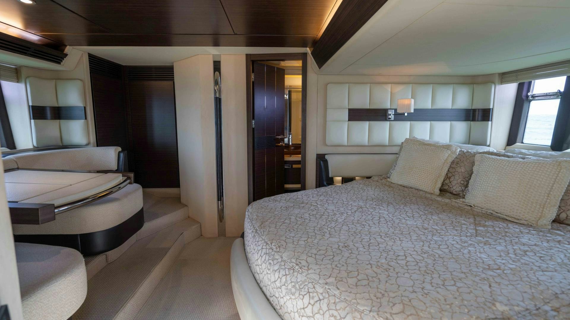 a large bedroom with a bed aboard 4-PLAY Yacht for Sale