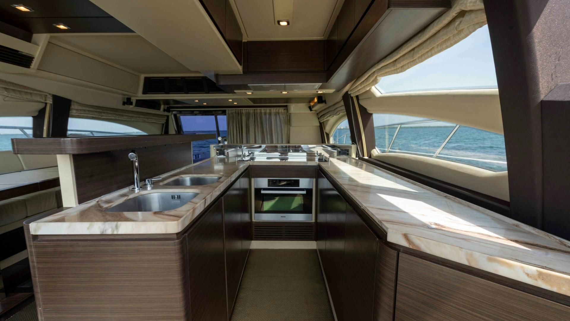 a kitchen with a large window aboard 4-PLAY Yacht for Sale
