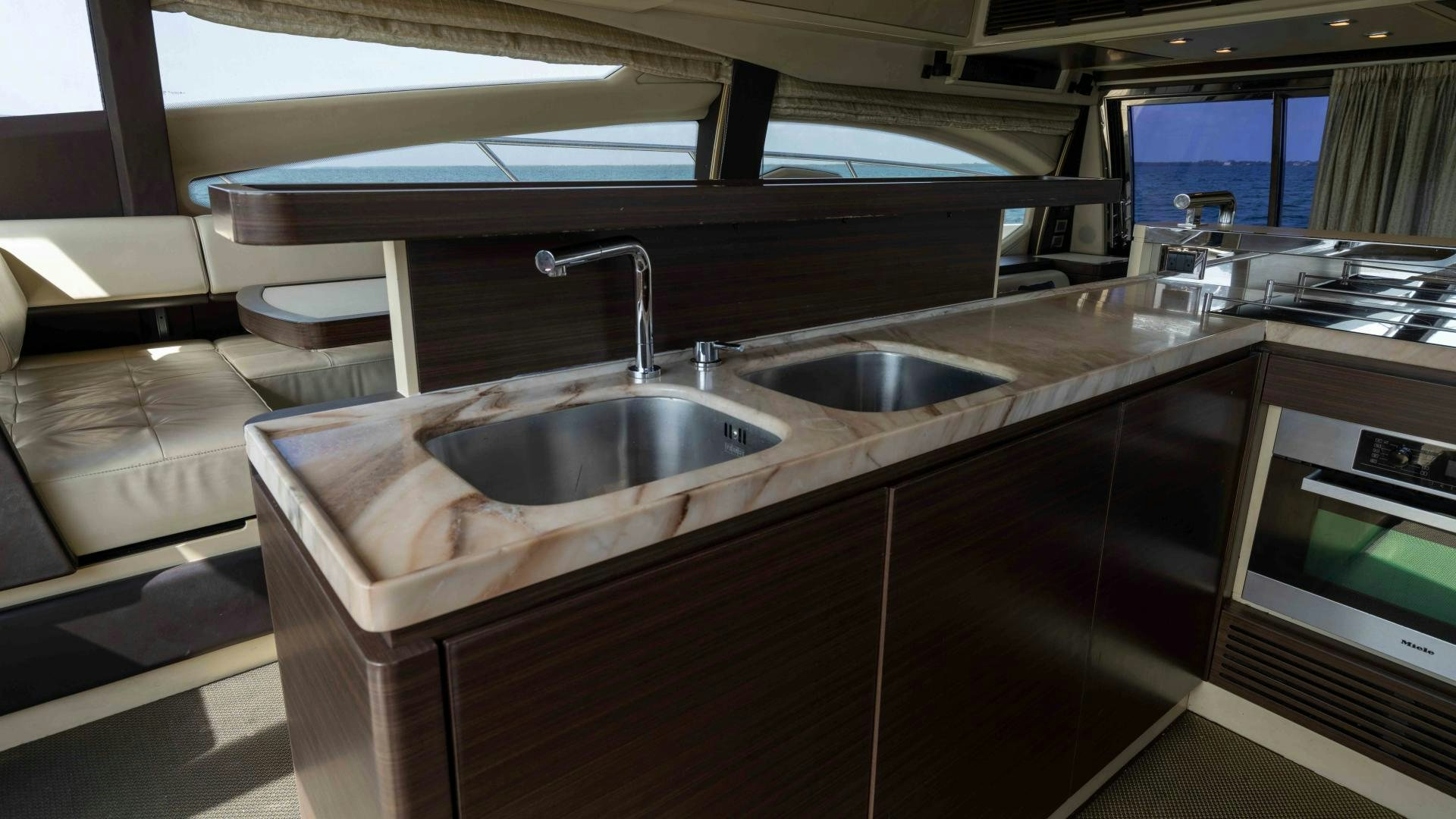 a kitchen with a sink and a counter aboard 4-PLAY Yacht for Sale