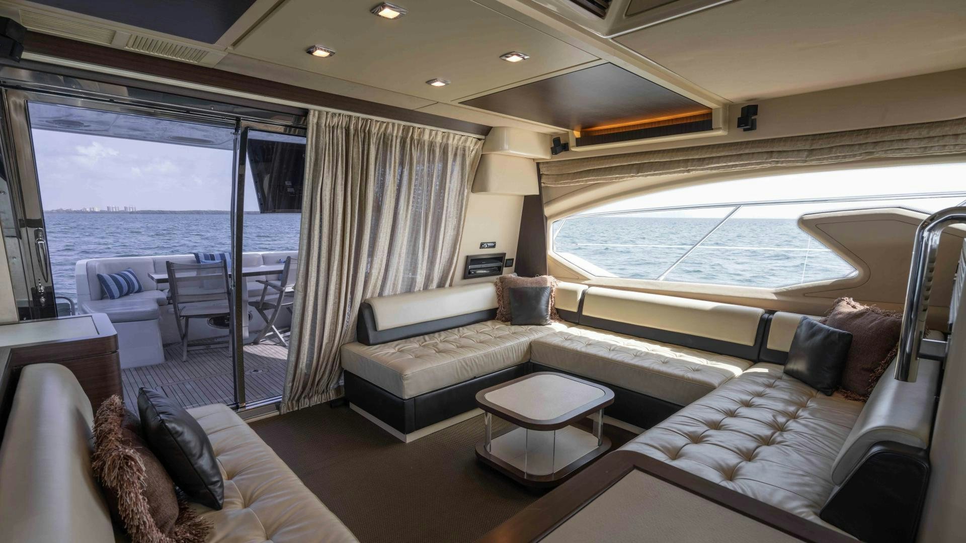 a large living room with a large balcony aboard 4-PLAY Yacht for Sale