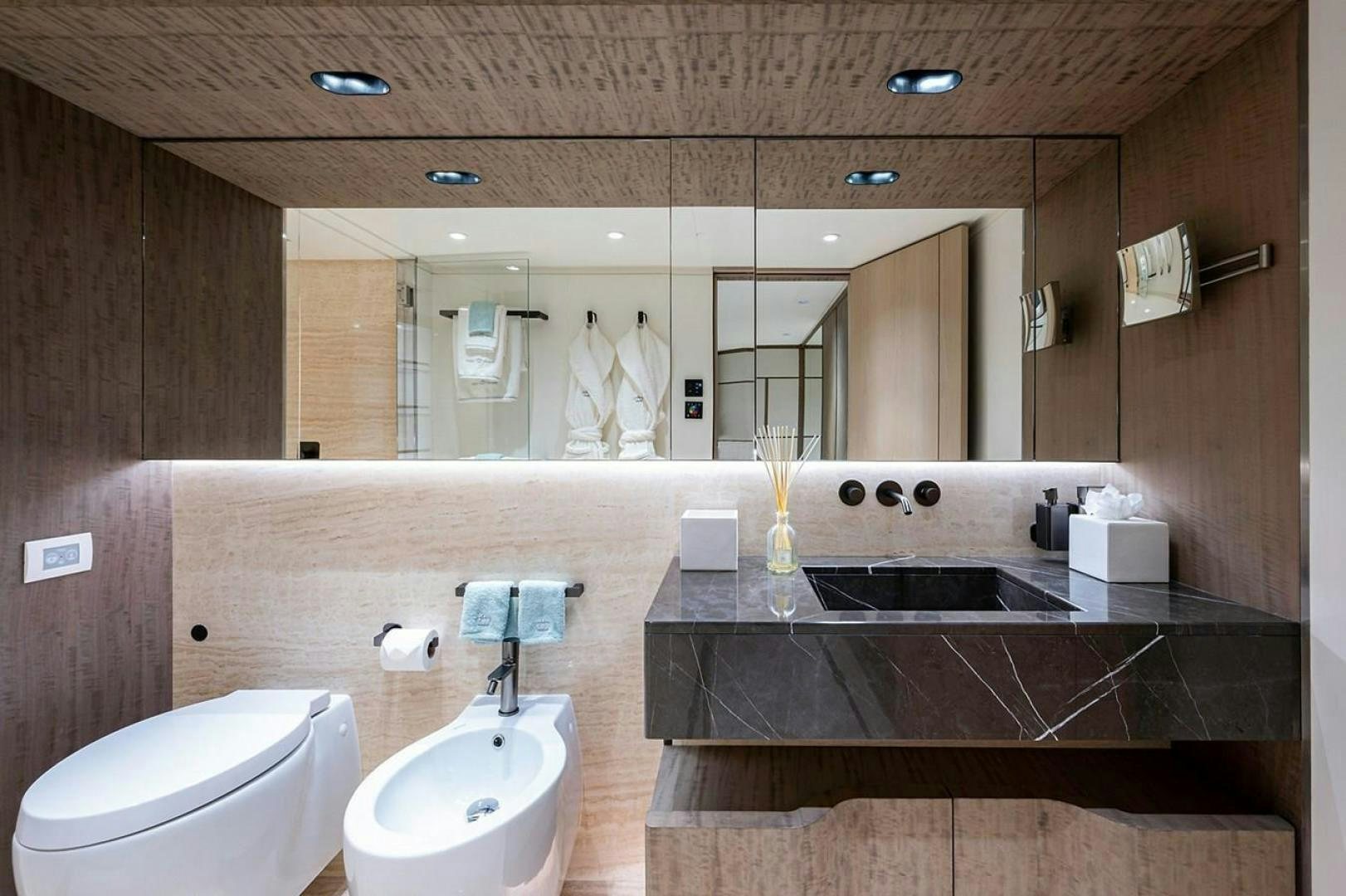 a bathroom with a sink and a toilet aboard CHECKED OUT Yacht for Sale