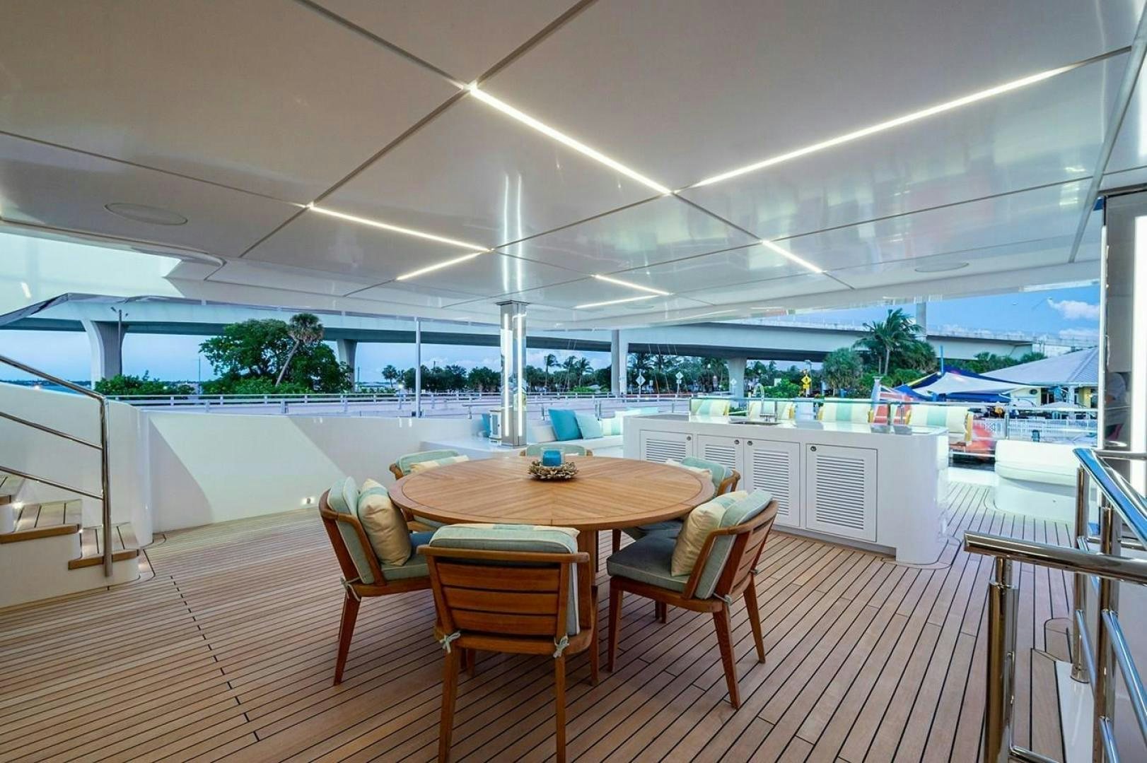 a table and chairs in a room aboard CHECKED OUT Yacht for Sale