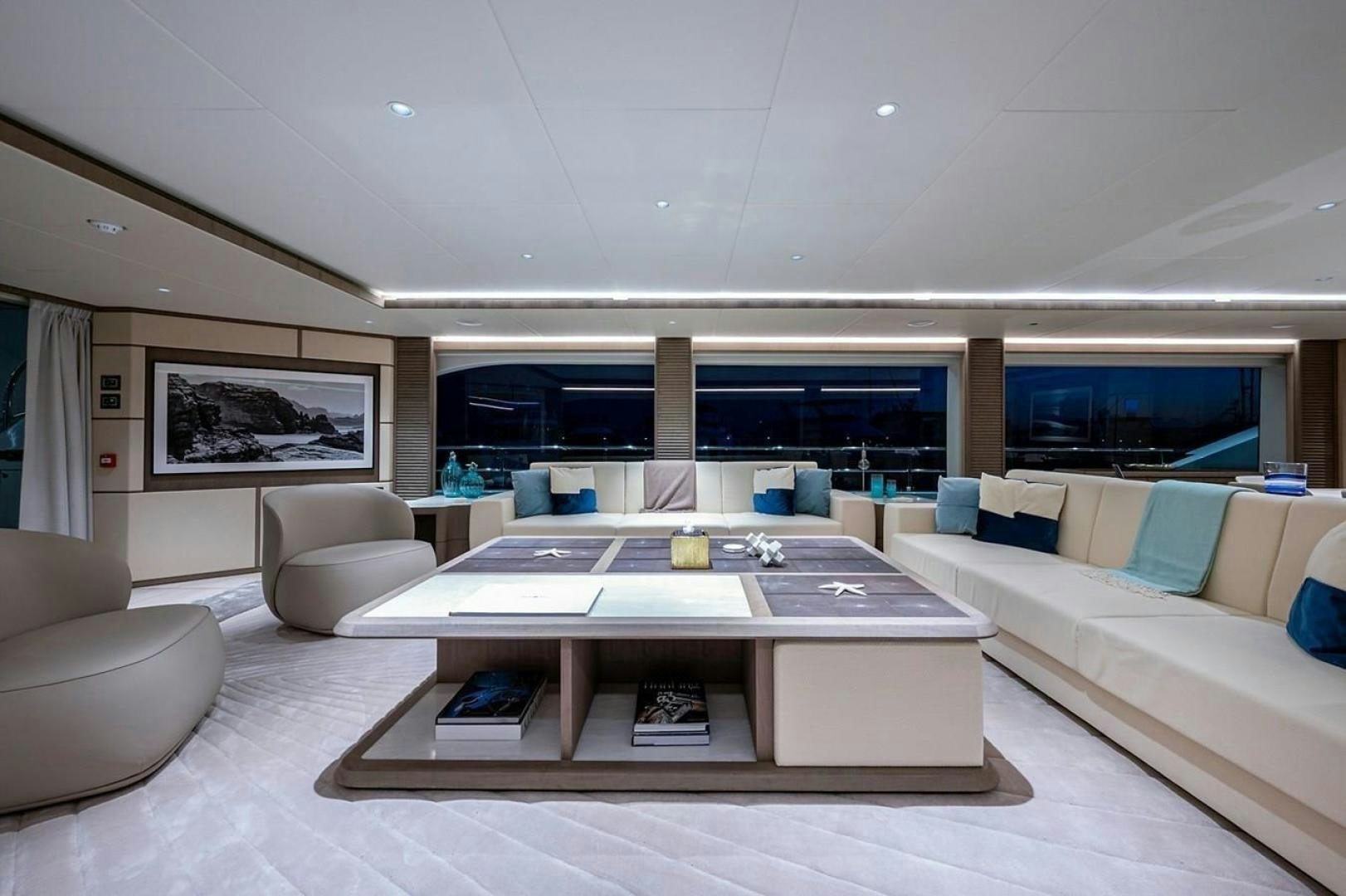 a modern living room with a large open floor plan aboard CHECKED OUT Yacht for Sale