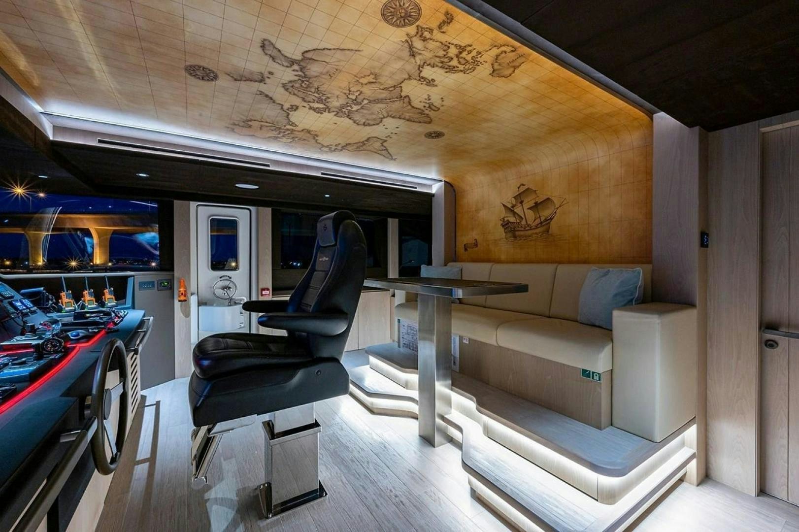 a room with a couch and a table aboard CHECKED OUT Yacht for Sale