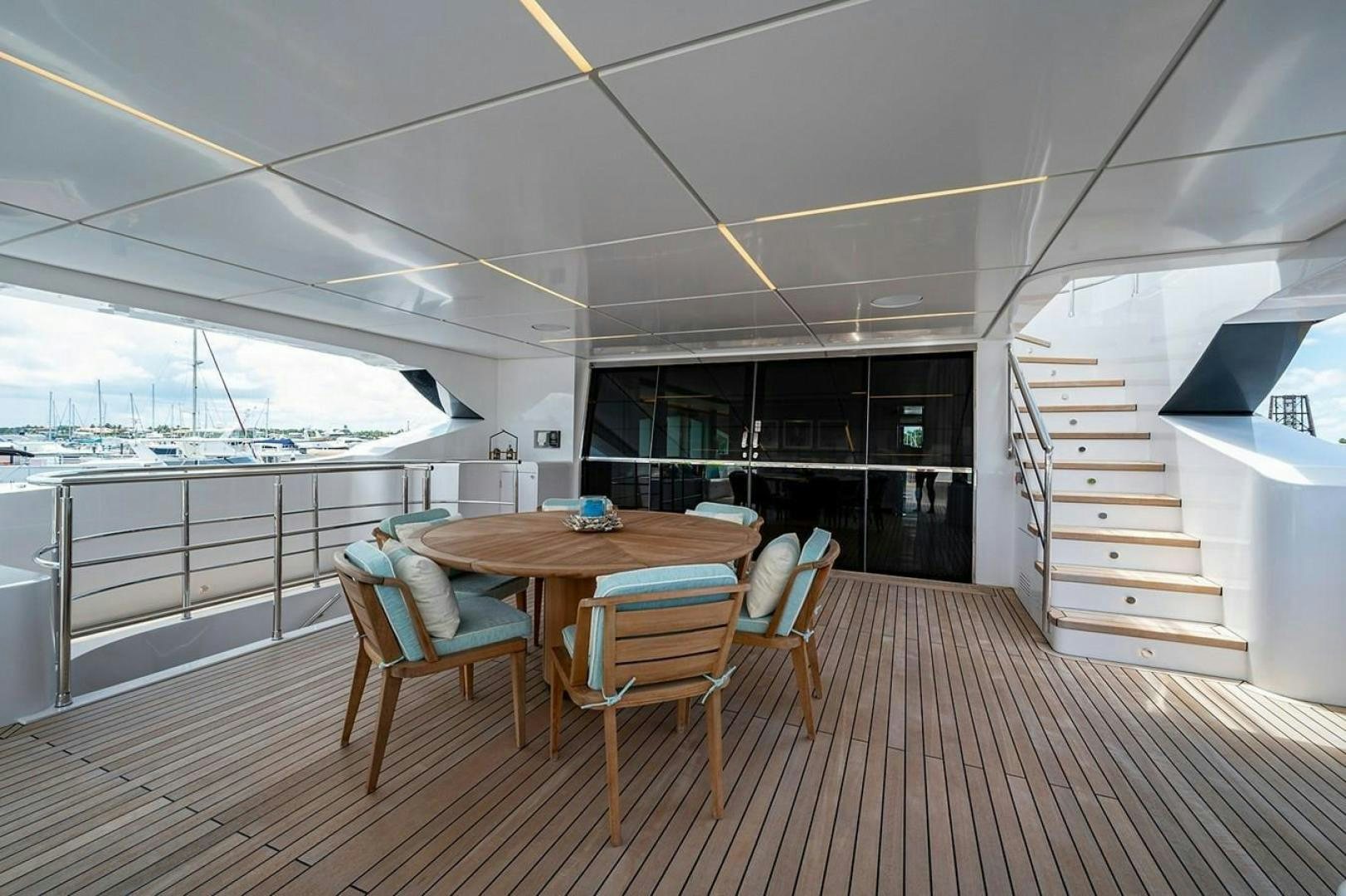 a room with a table and chairs aboard CHECKED OUT Yacht for Sale