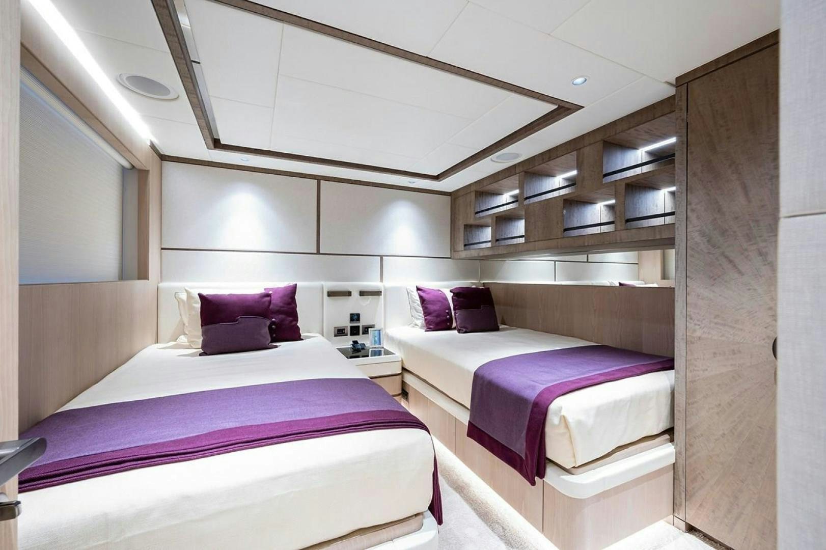 a couple of beds in a room aboard CHECKED OUT Yacht for Sale