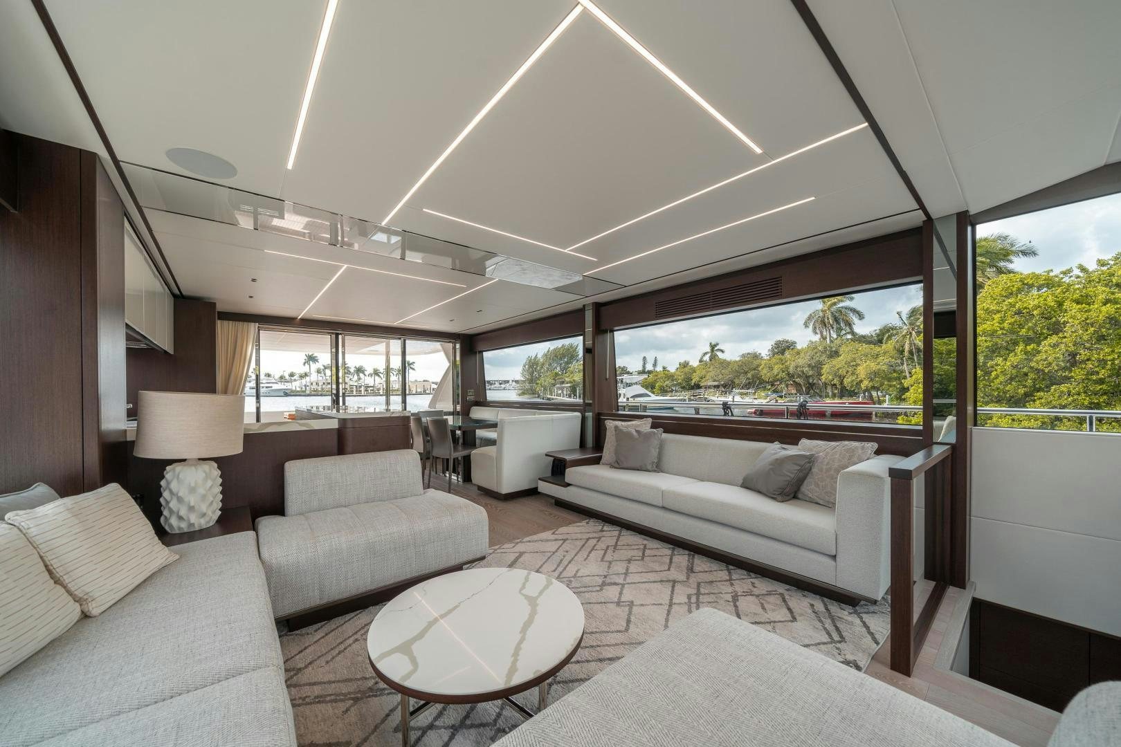 a living room with a large window aboard ONE Yacht for Sale