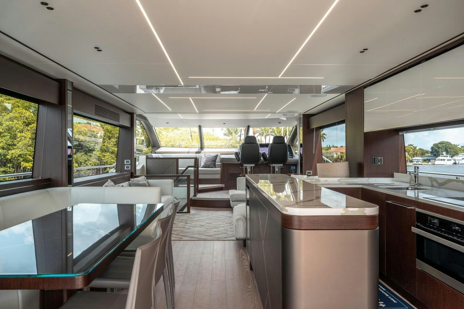 a large room with a table and chairs aboard ONE Yacht for Sale