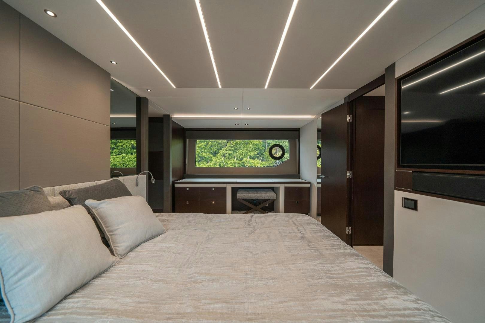 a large bed in a room aboard ONE Yacht for Sale