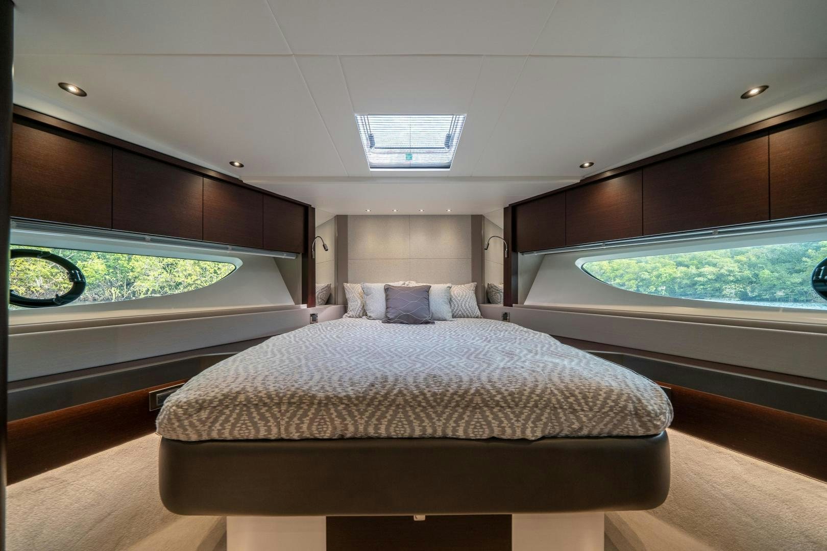 a large bed in a room aboard ONE Yacht for Sale
