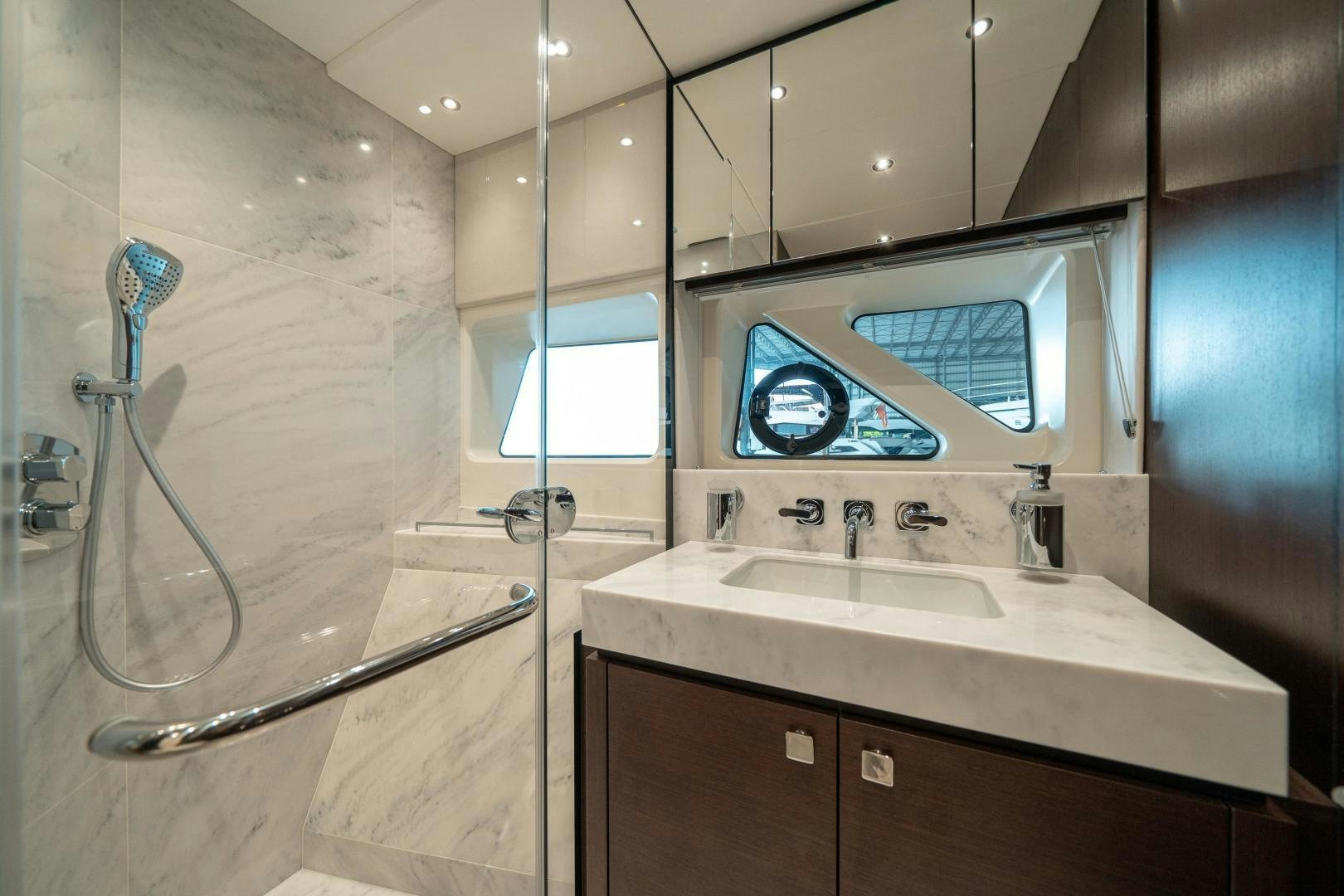 a bathroom with a glass shower aboard ONE Yacht for Sale