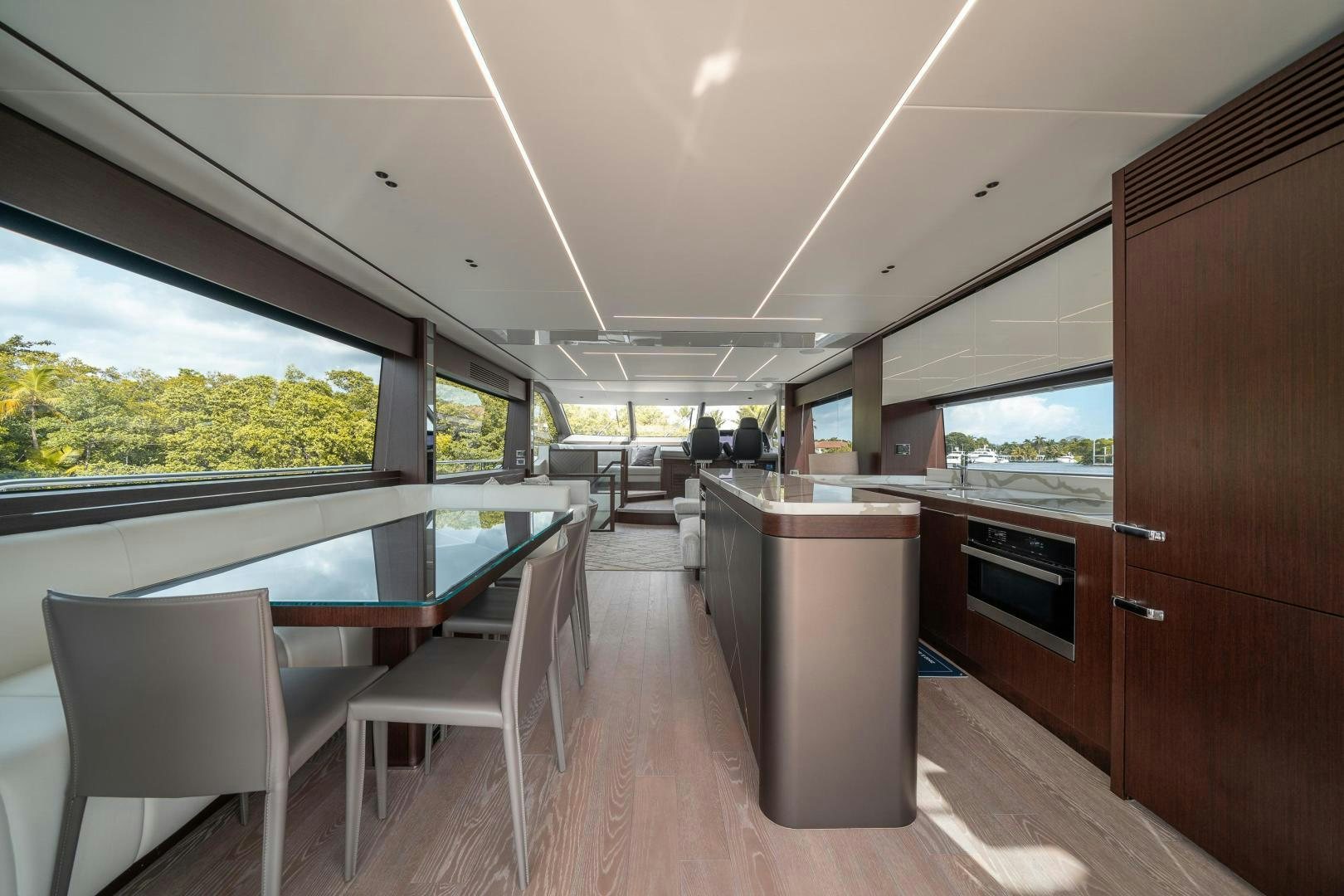 a large wooden room with a pool table and chairs aboard ONE Yacht for Sale