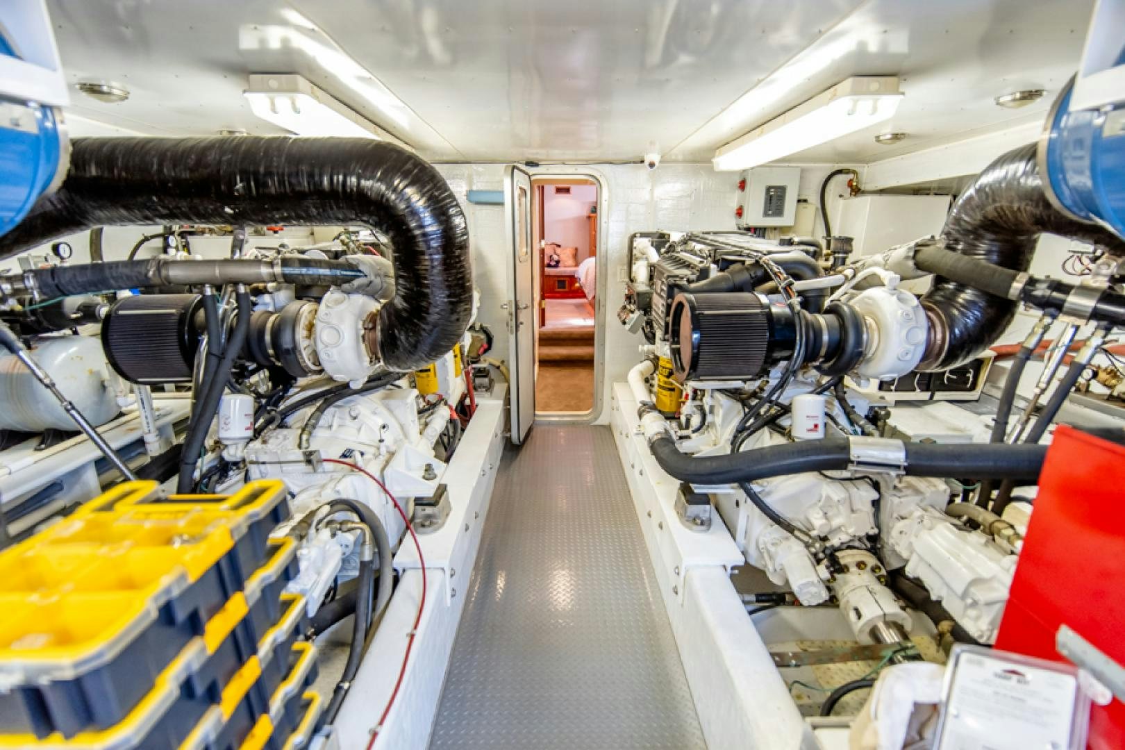 a car with a large engine aboard the happy boat Yacht for Sale