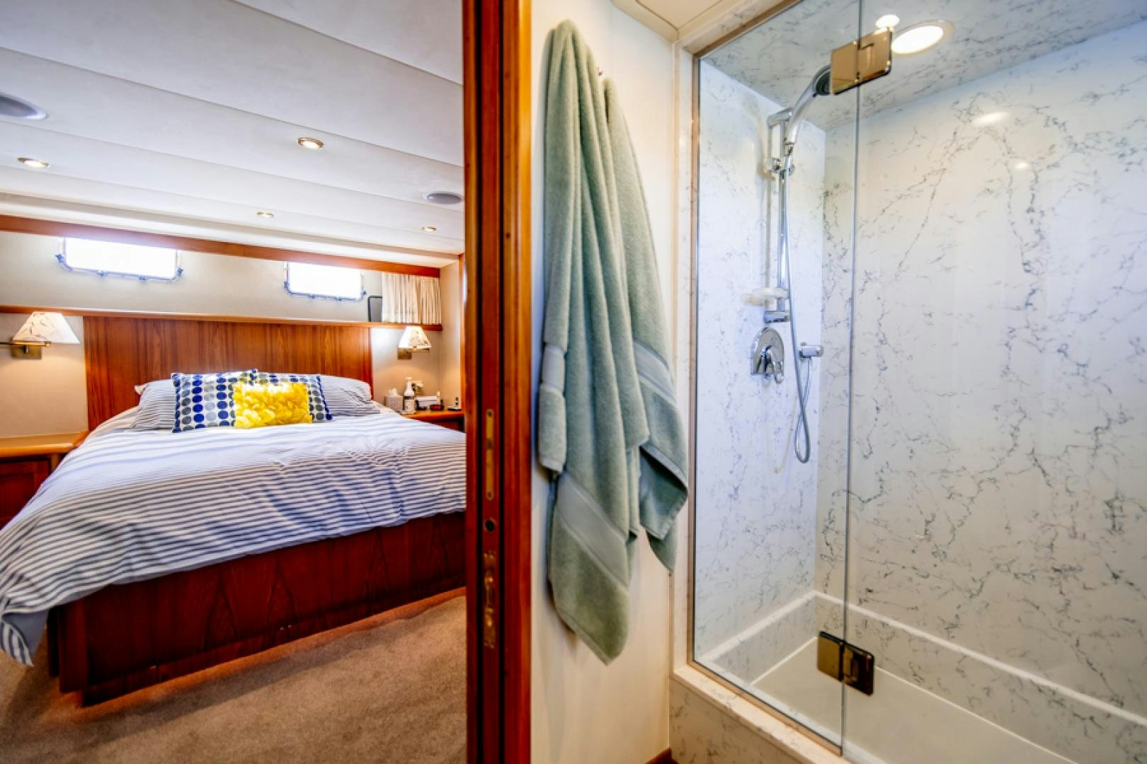 a bed in a room aboard the happy boat Yacht for Sale