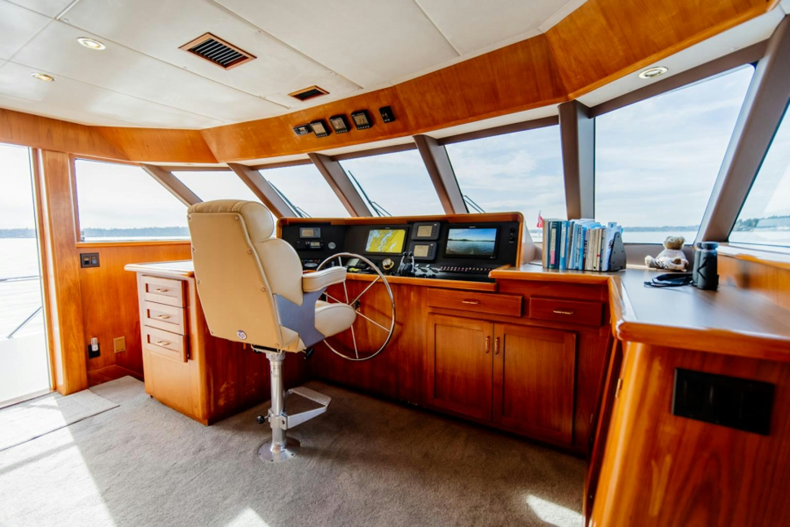 a room with a desk and computer aboard the happy boat Yacht for Sale