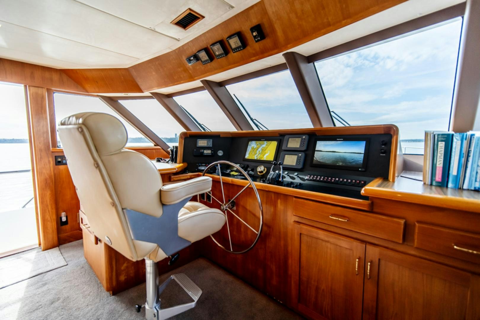 a chair in front of a desk aboard the happy boat Yacht for Sale