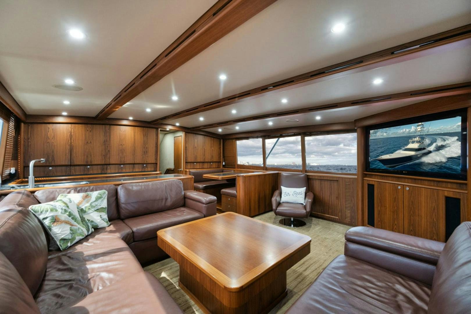 a living room with a large screen aboard SIR REEL Yacht for Sale