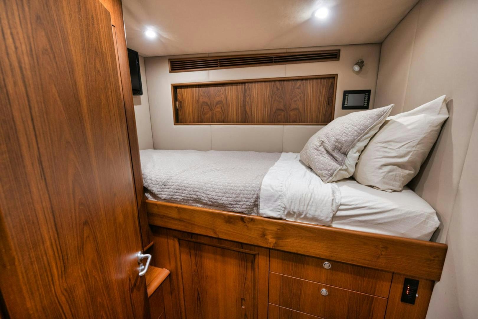 a bed with white sheets aboard SIR REEL Yacht for Sale