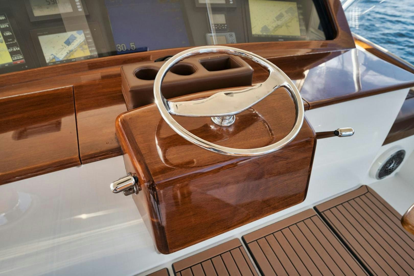 a brown and white guitar on a white surface aboard SIR REEL Yacht for Sale