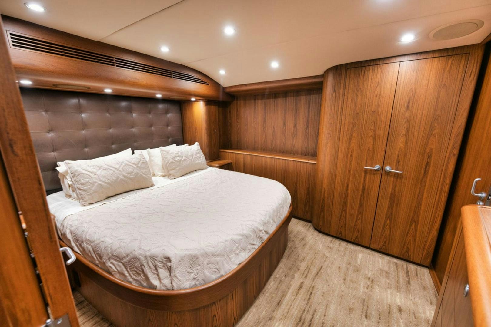 a bed in a wooden room aboard SIR REEL Yacht for Sale