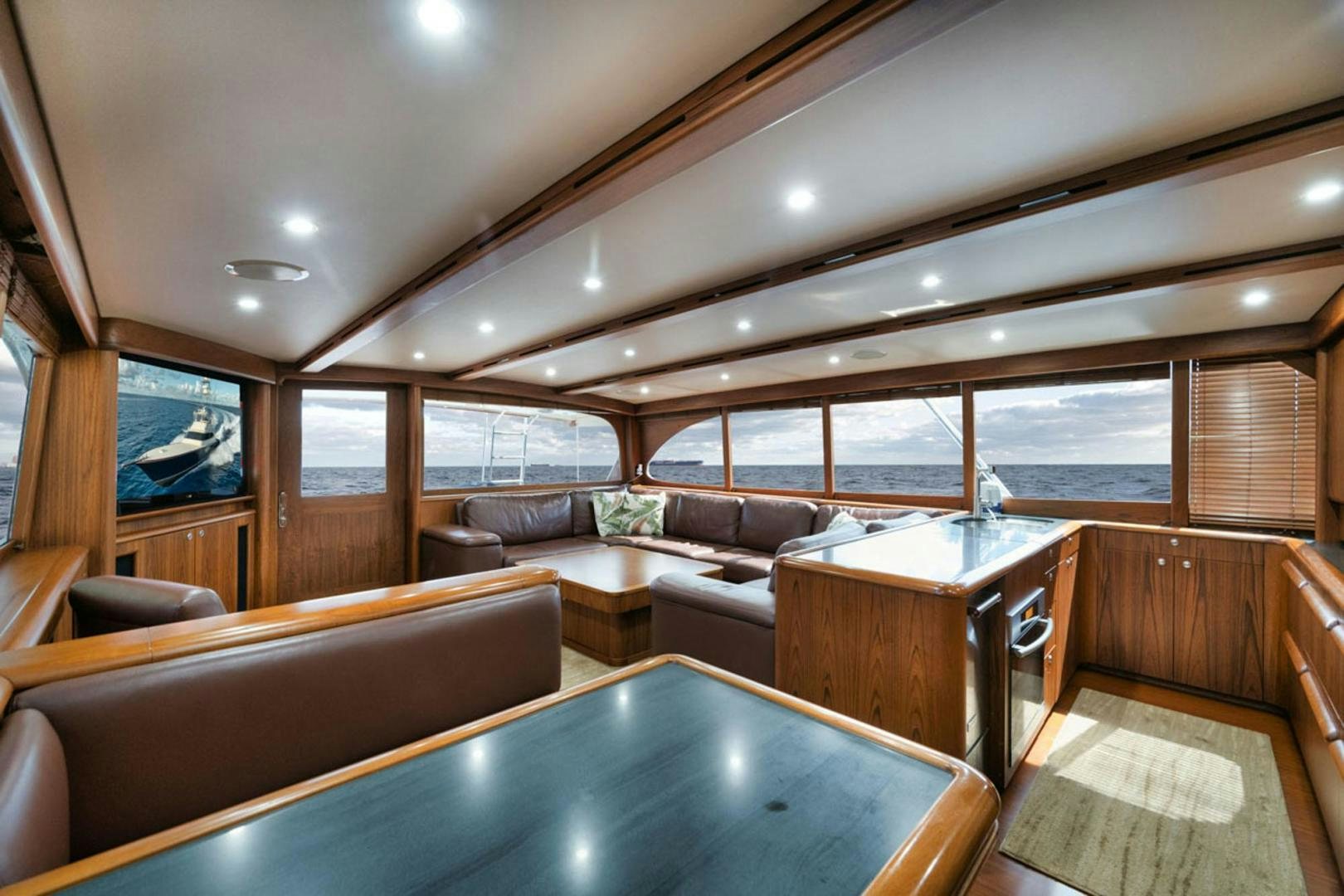 a living room with a large window aboard SIR REEL Yacht for Sale