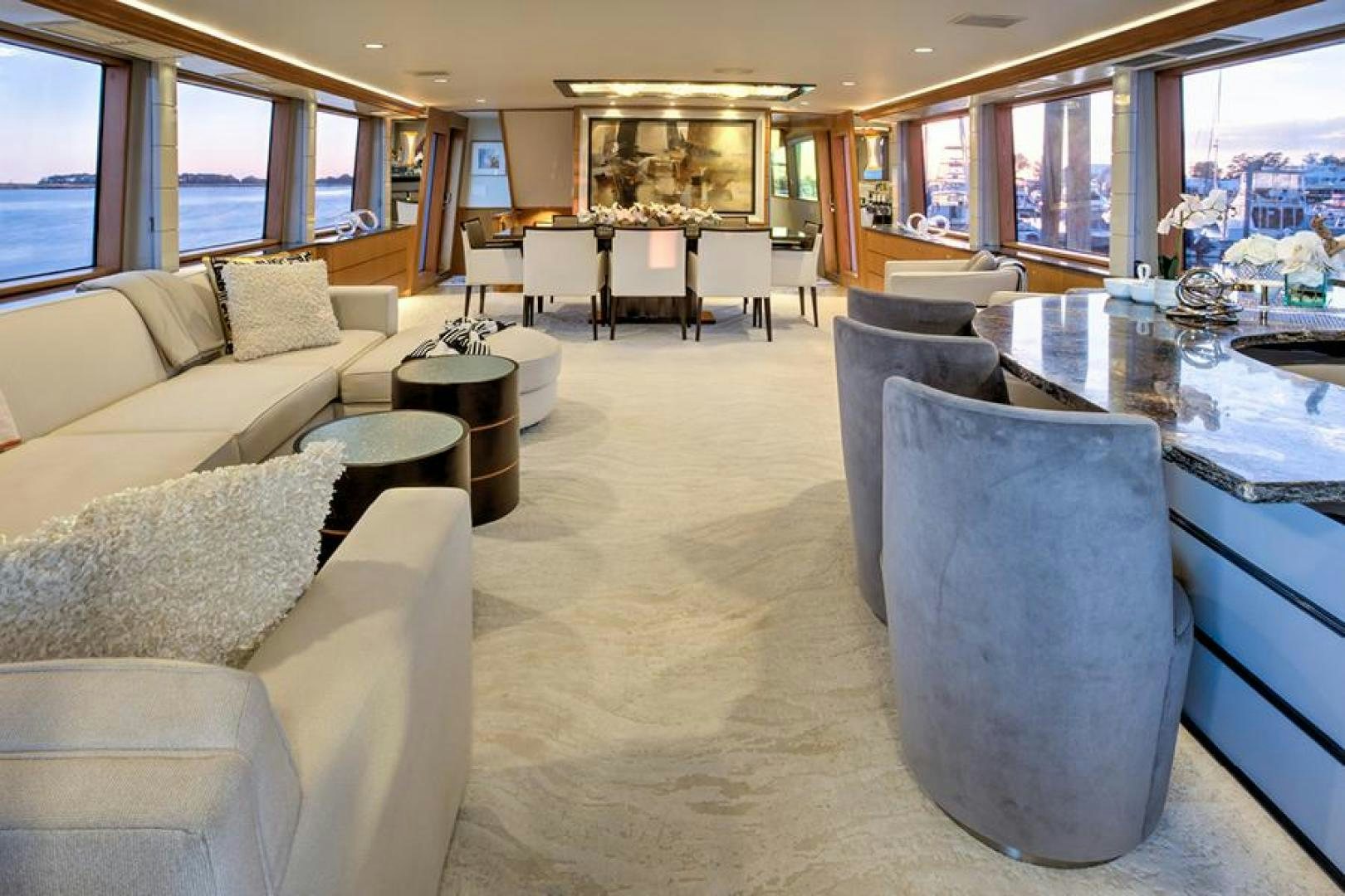 a room with couches and tables aboard MARGATE Yacht for Charter