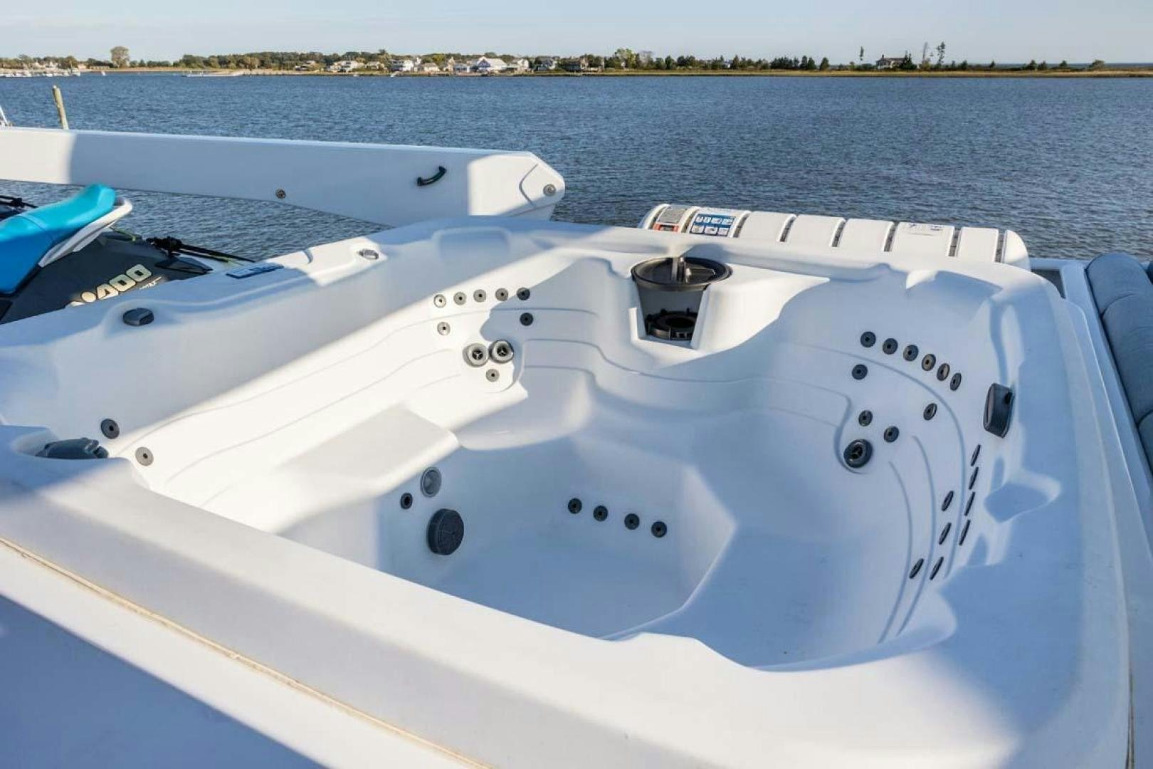 a white boat on the water aboard MARGATE Yacht for Charter