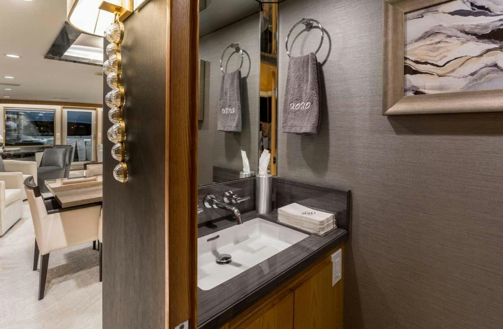 a bathroom with a sink and a mirror aboard MARGATE Yacht for Charter