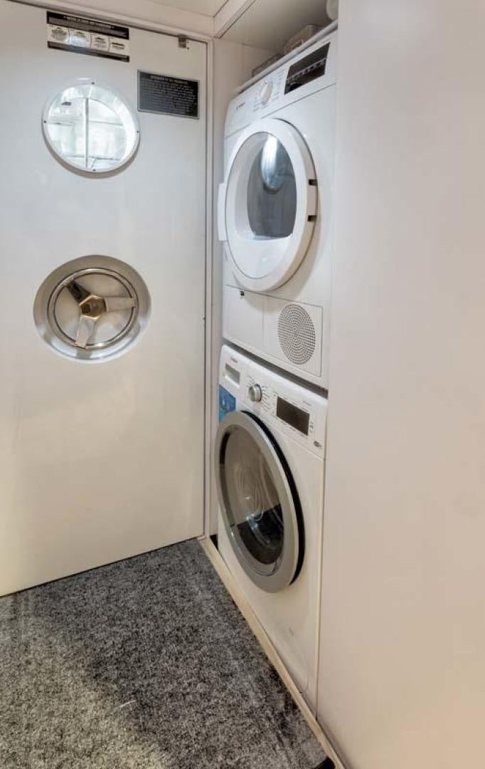 a white laundry room aboard MARGATE Yacht for Charter