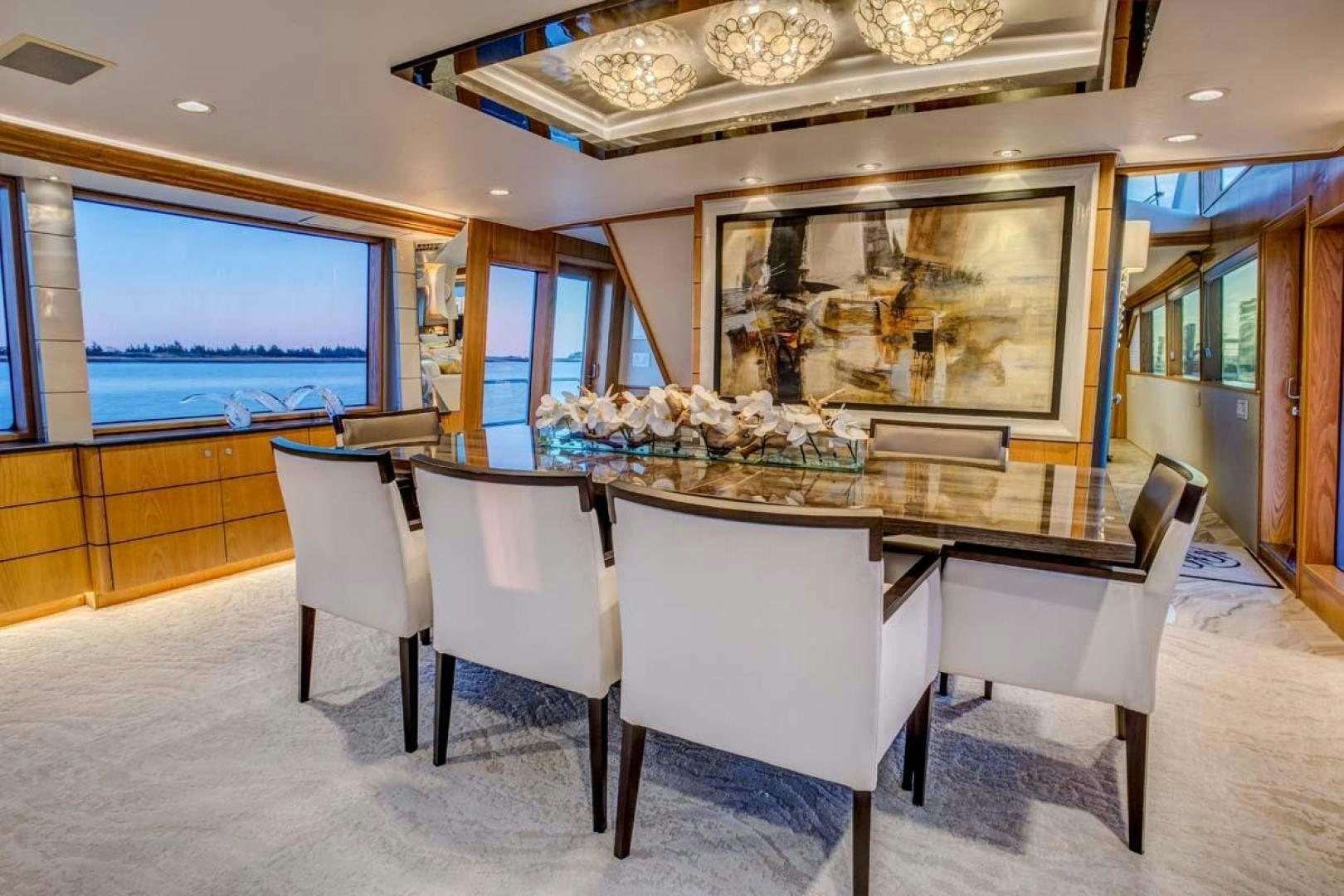 a room with a table and chairs aboard MARGATE Yacht for Charter
