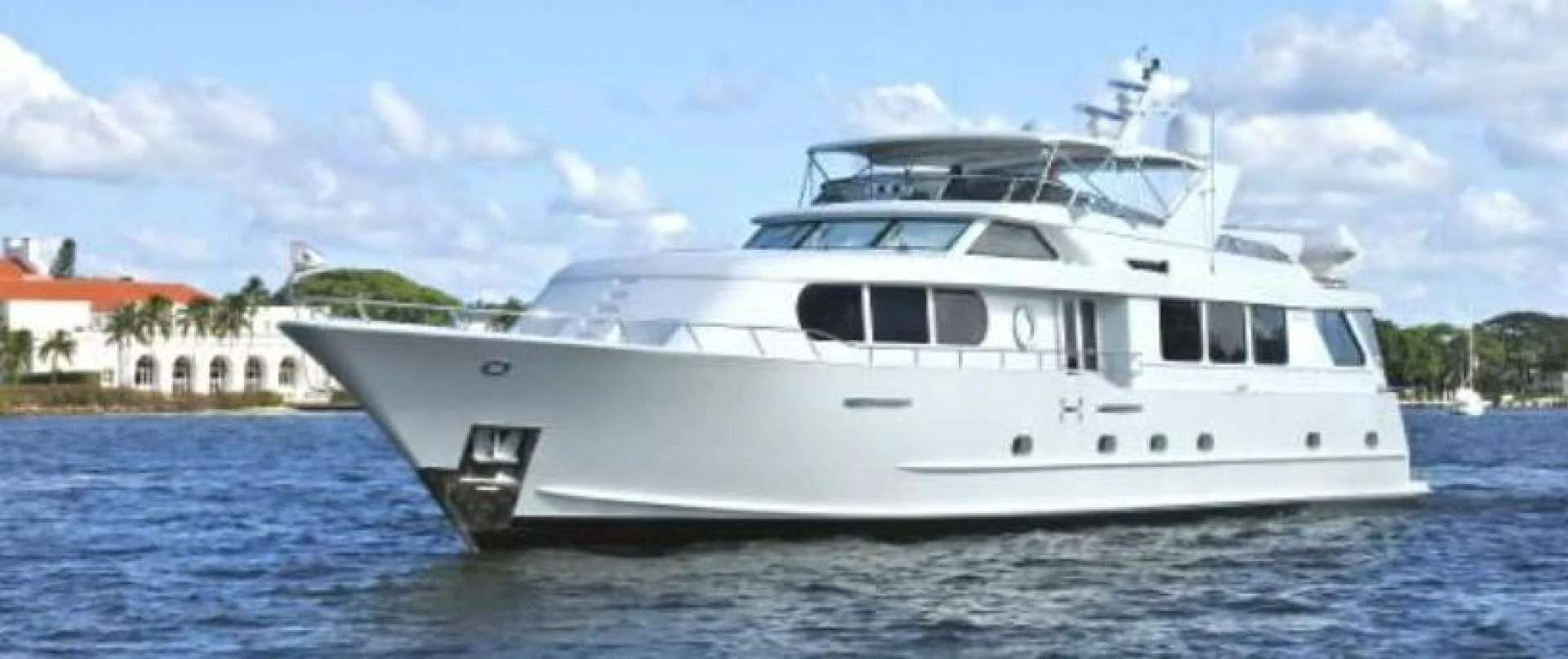 a white yacht on the water aboard MY LADY ALASKA Yacht for Sale