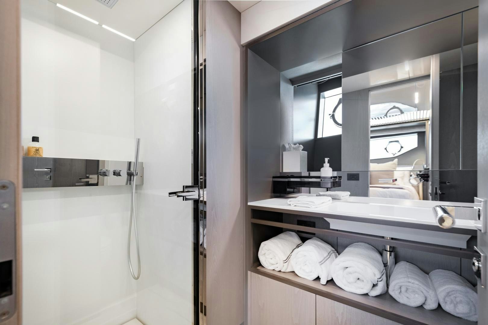 a bathroom with a large mirror aboard FERRETTI 850 Yacht for Sale