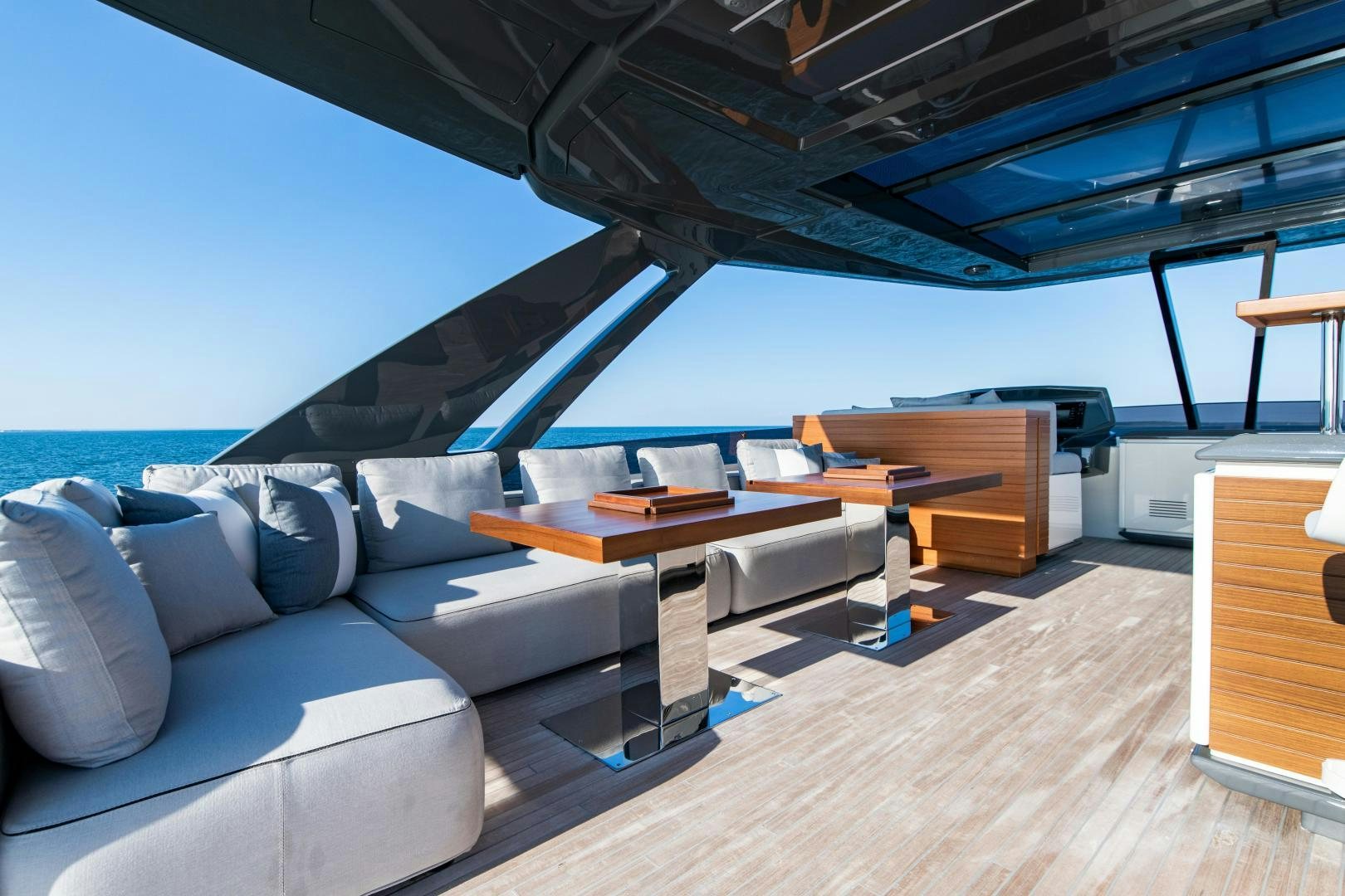 a room with a couch and a table aboard FERRETTI 850 Yacht for Sale
