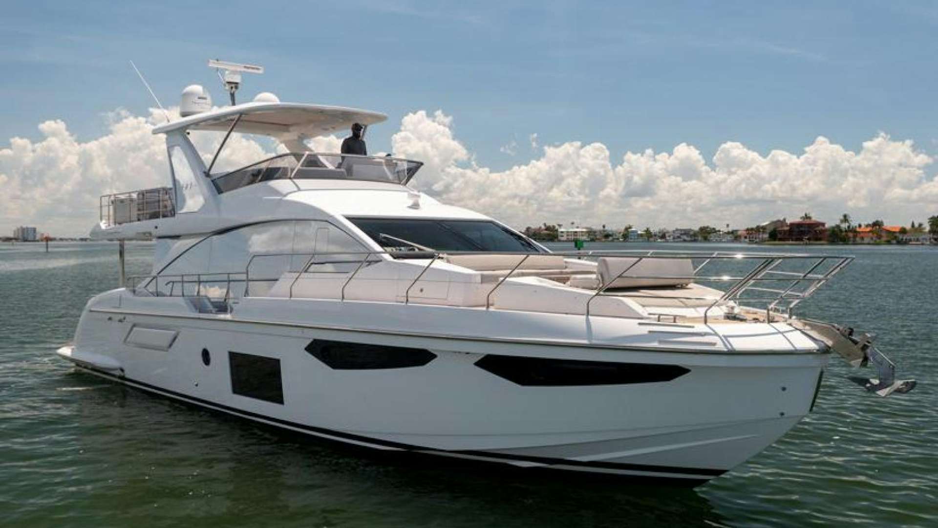 a white yacht on the water aboard GIA Yacht for Sale
