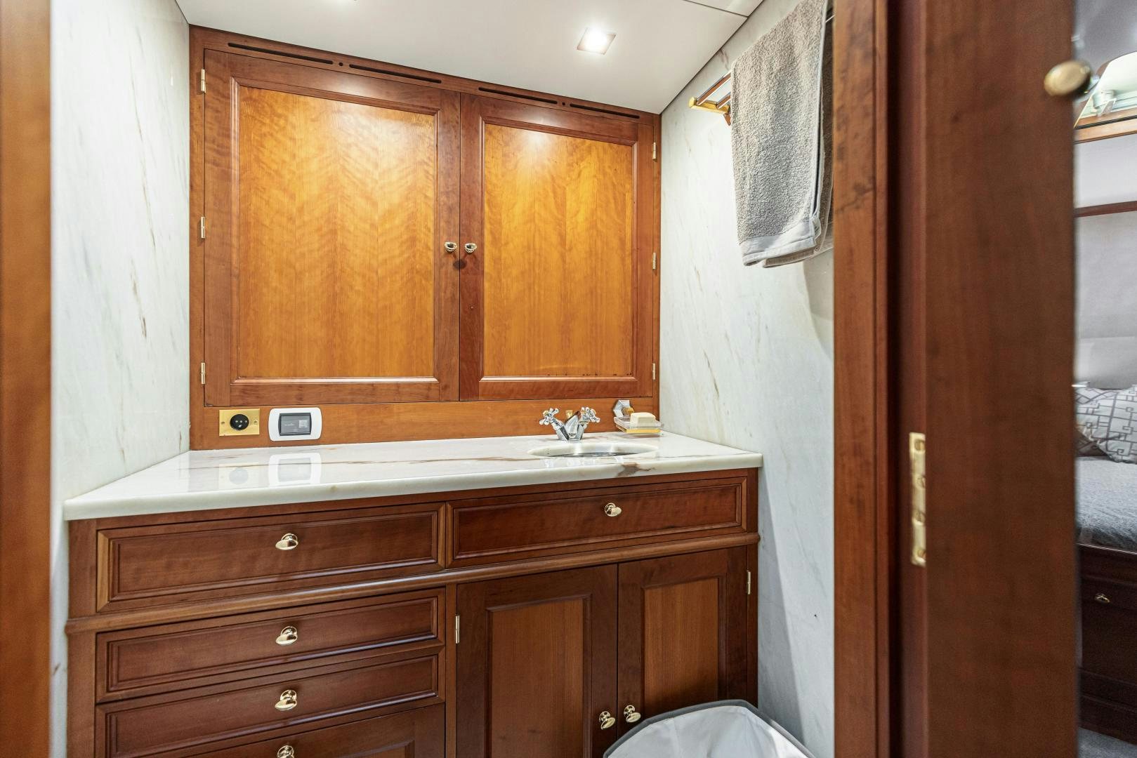 a kitchen with wooden cabinets aboard FANCY Yacht for Sale