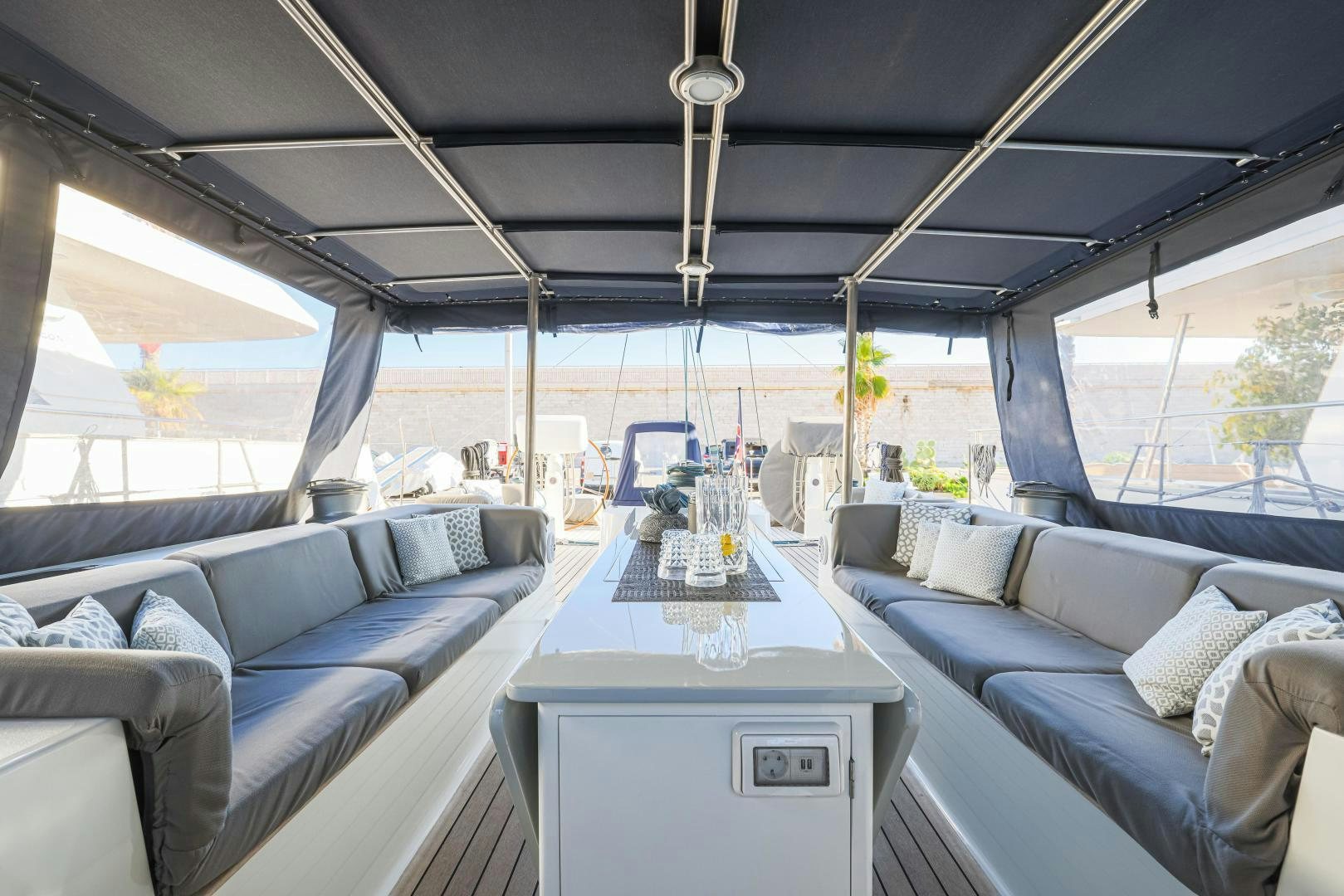a room with a table and couches aboard FANCY Yacht for Sale