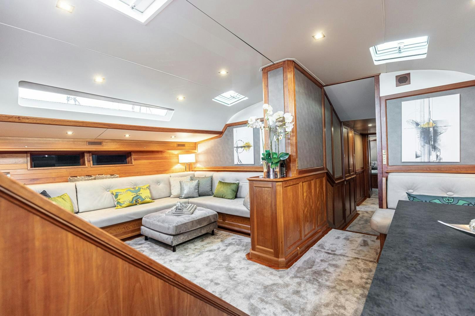 a large living room with a large mirror aboard FANCY Yacht for Sale