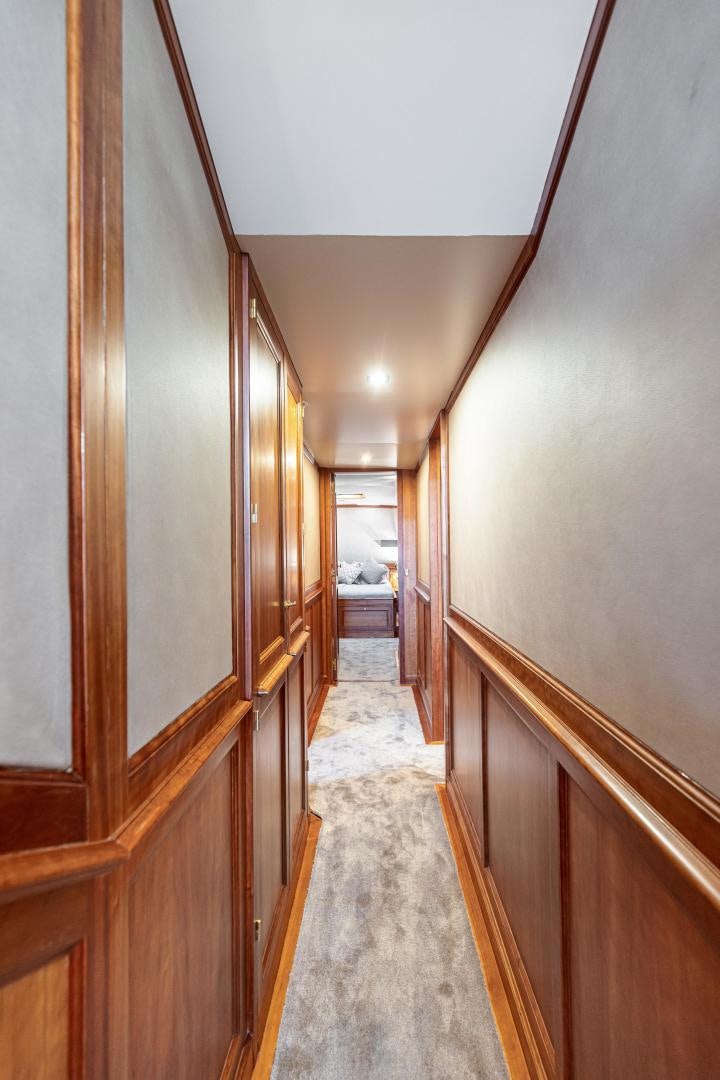 a hallway with wood doors aboard FANCY Yacht for Sale
