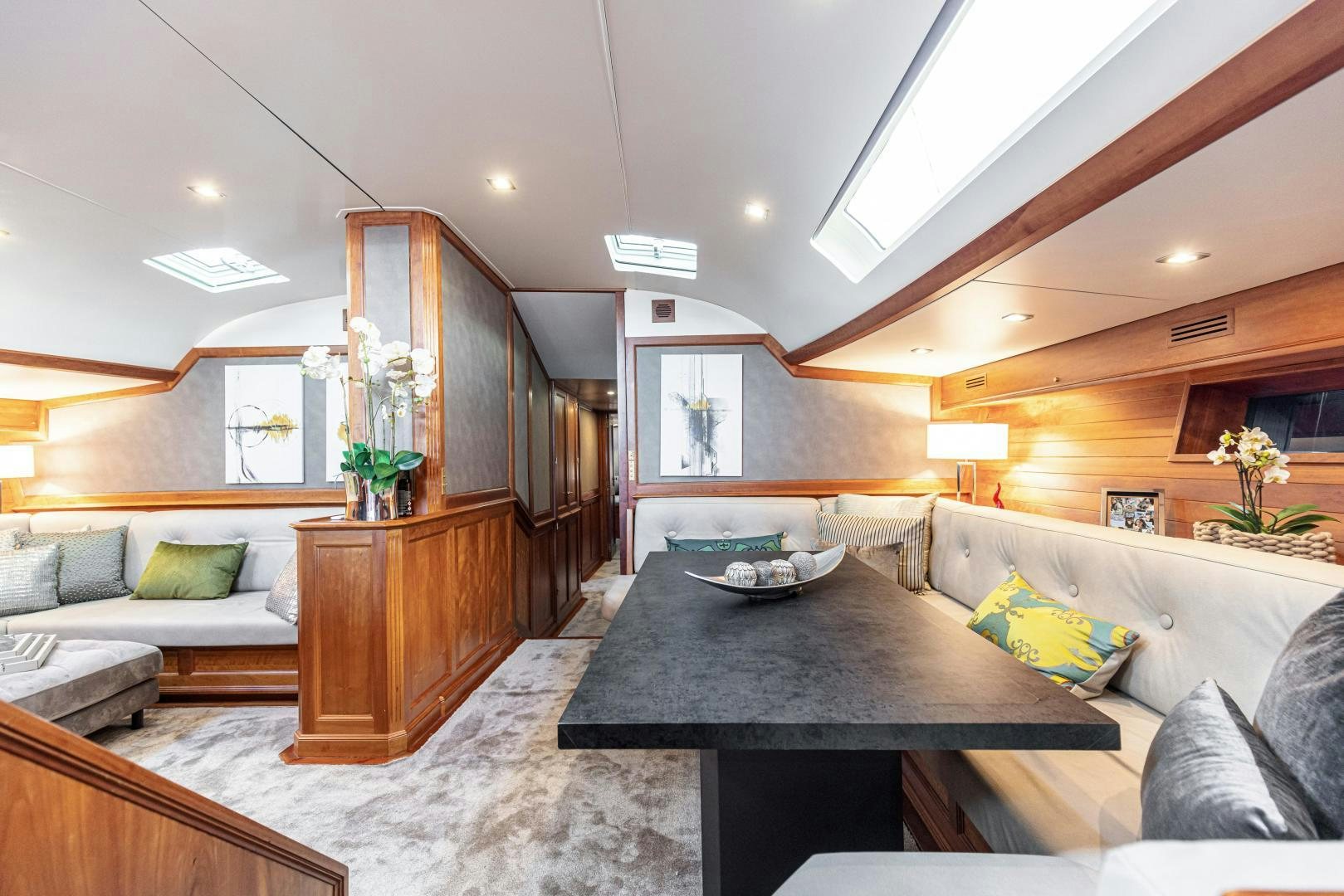 a room with a bed and a table aboard FANCY Yacht for Sale