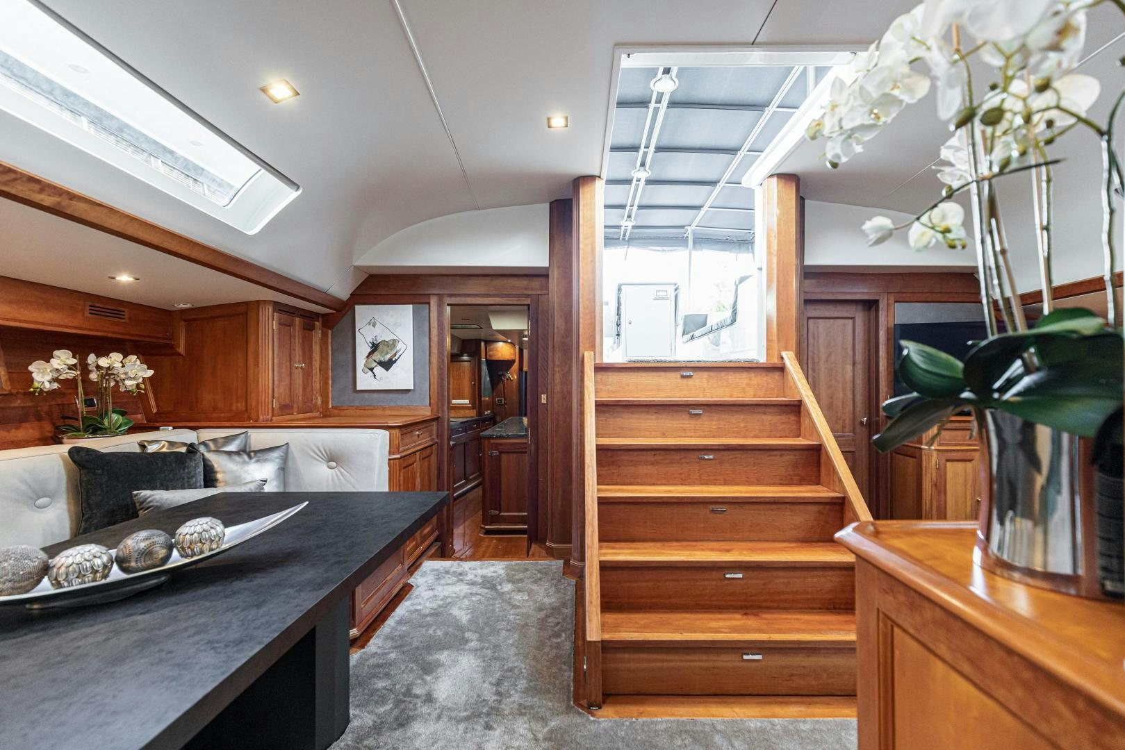 a kitchen with wooden cabinets aboard FANCY Yacht for Sale