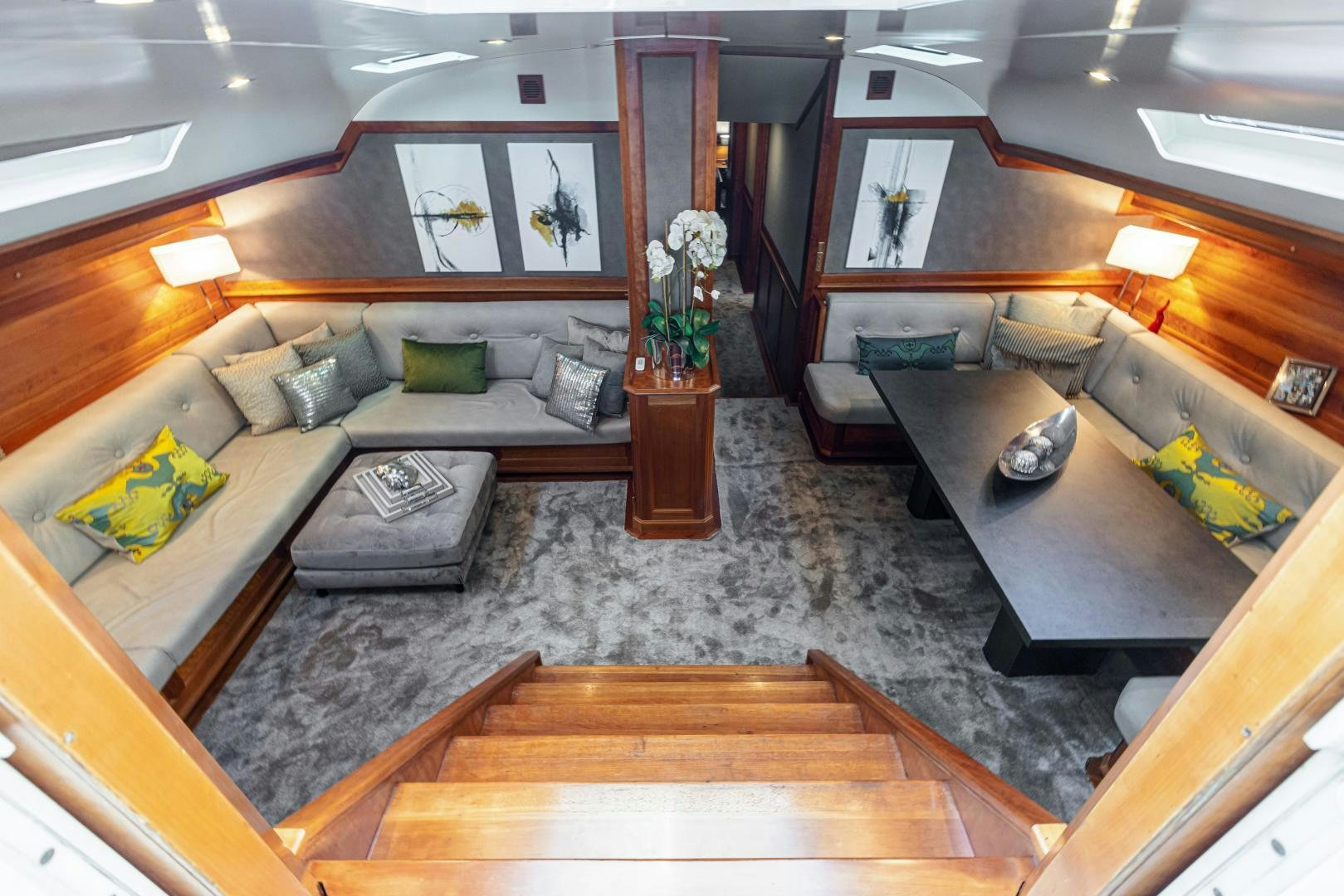 a living room with a couch and a coffee table aboard FANCY Yacht for Sale