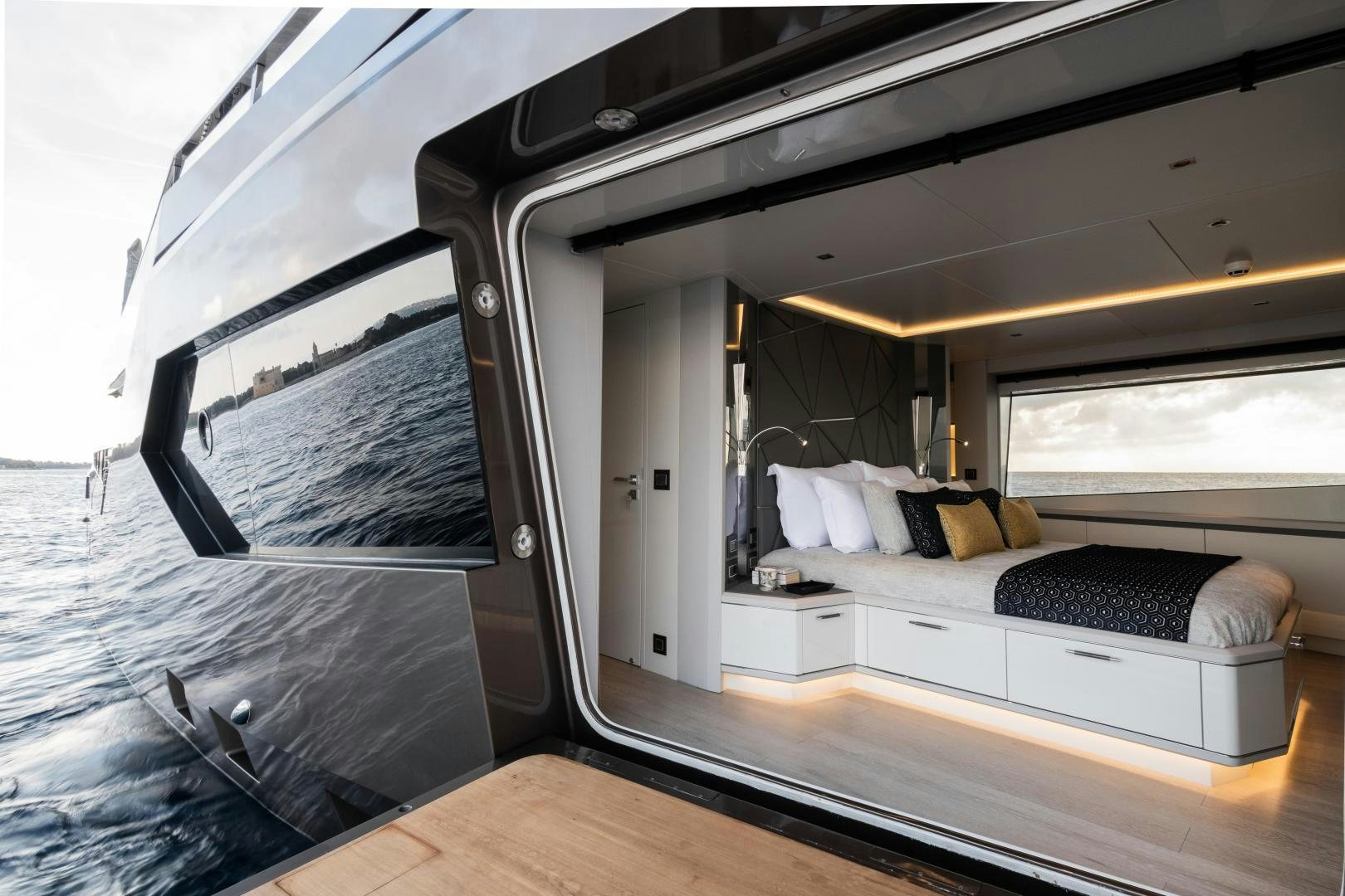 a room with a bed and a couch aboard EVADNE ROCK 85 HULL 4 Yacht for Sale