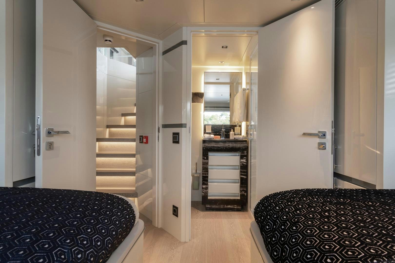 a room with a bed and a chair aboard EVADNE ROCK 85 HULL 4 Yacht for Sale