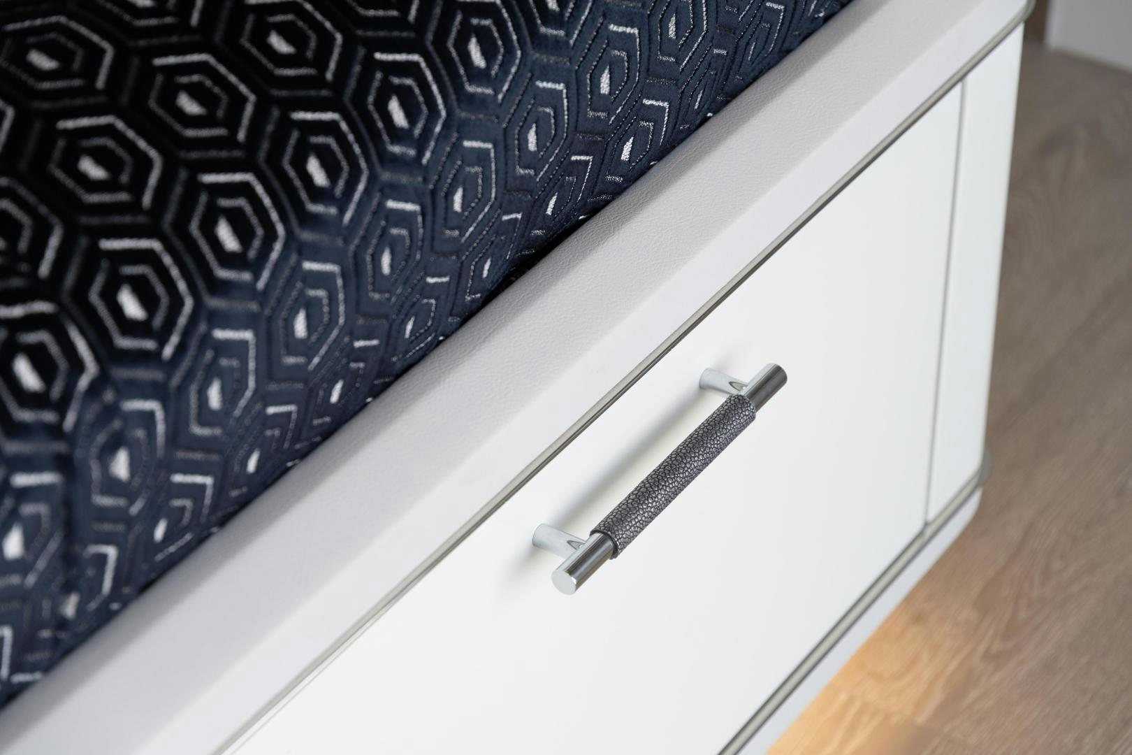 a pen on a book aboard EVADNE ROCK 85 HULL 4 Yacht for Sale