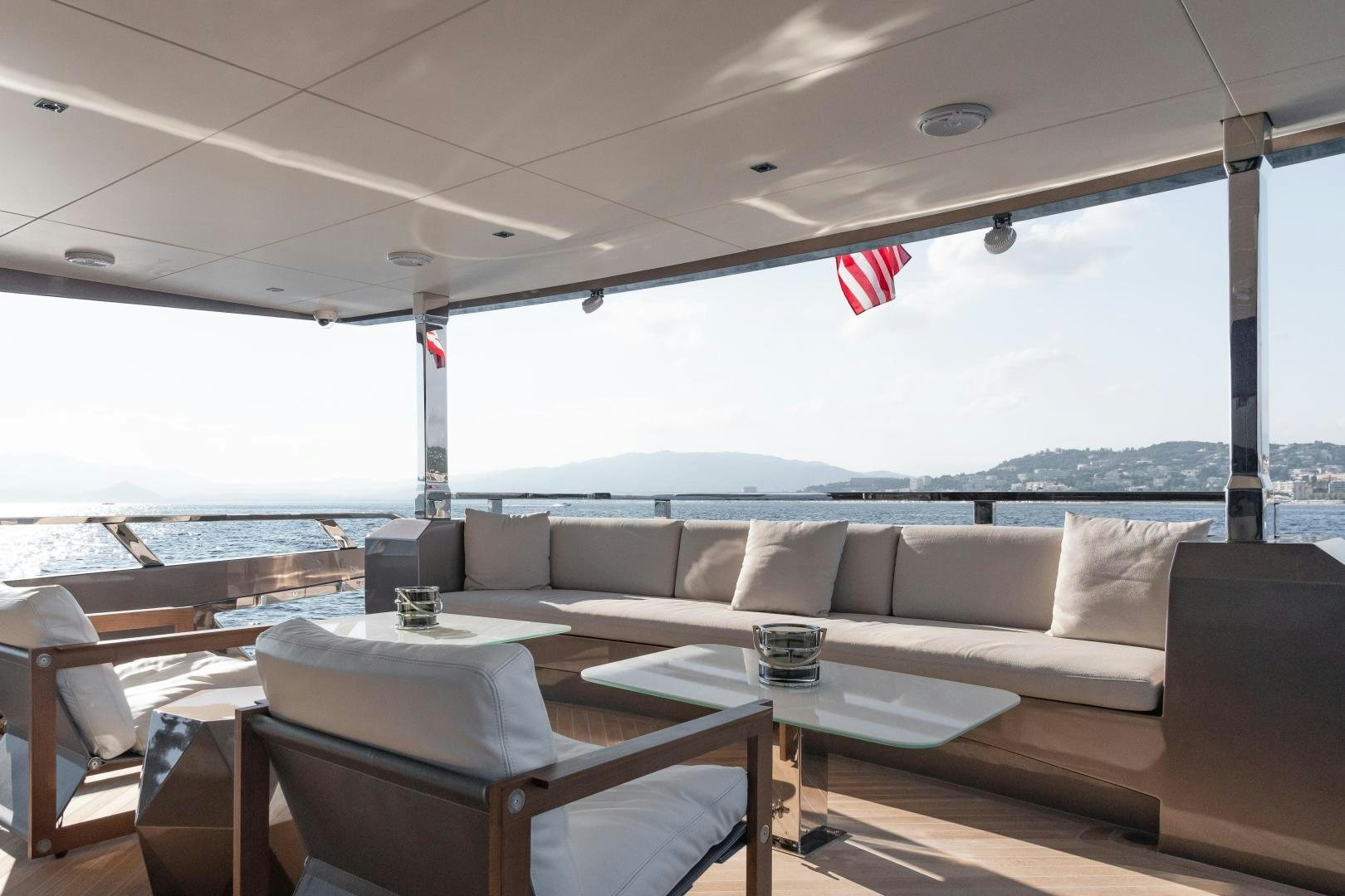 a living room with a large window aboard EVADNE ROCK 85 HULL 4 Yacht for Sale